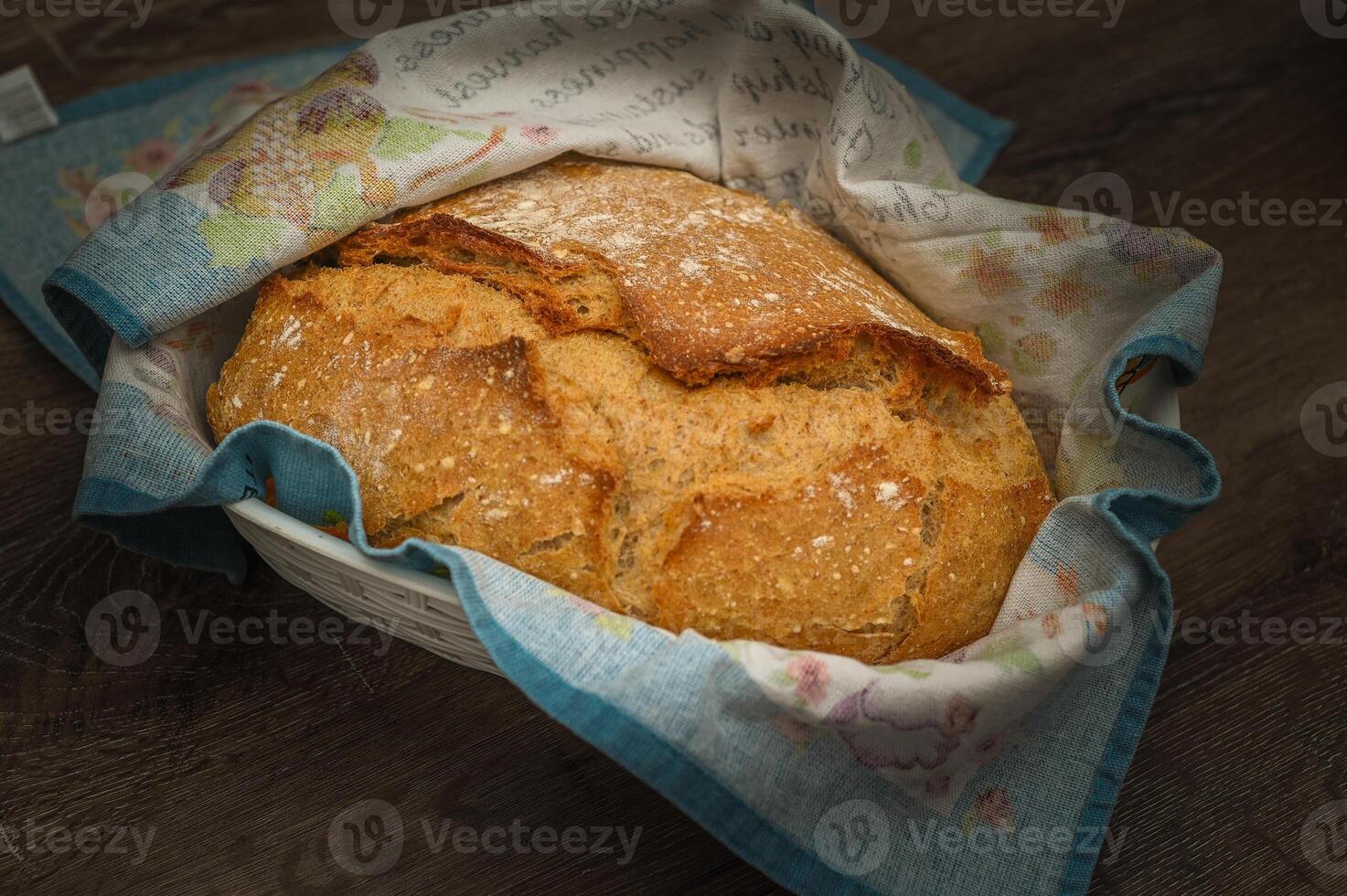 Homemade artisan bread on white wood rustic dinner table 1 photo
