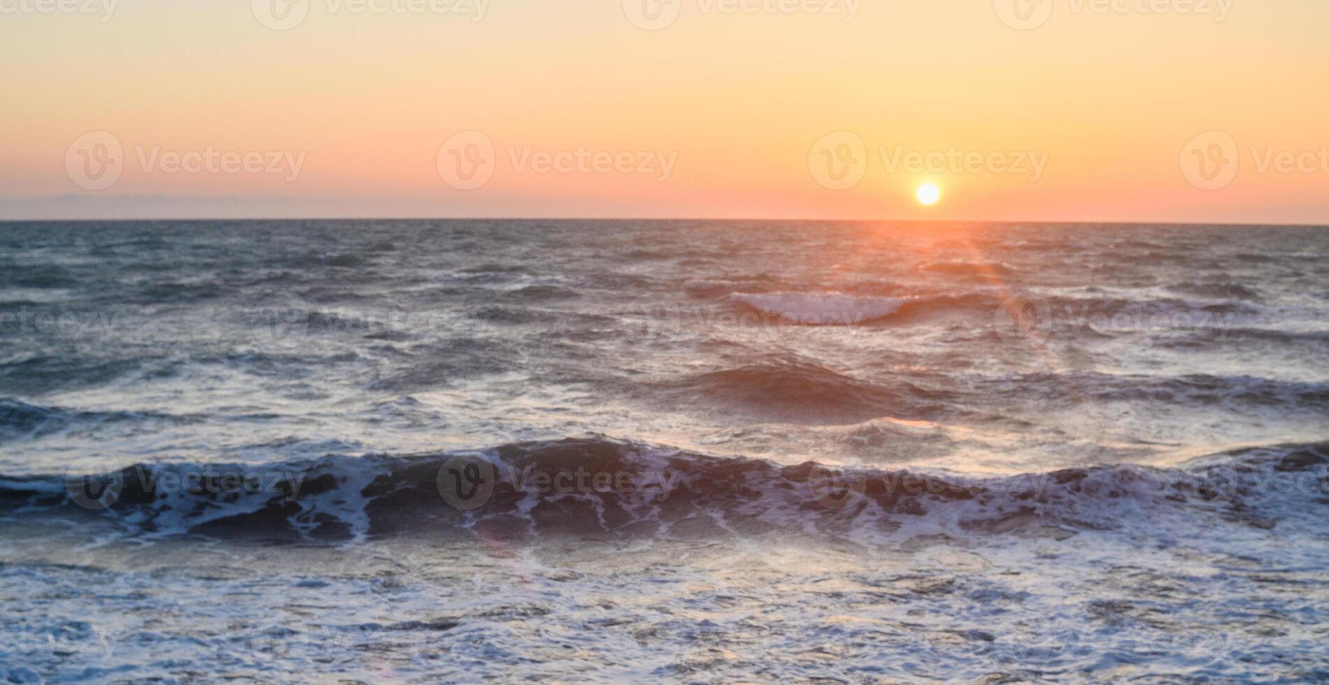 Beautiful view of the orange sunset over the island of Cyprus in the Mediterranean Sea. 1 photo
