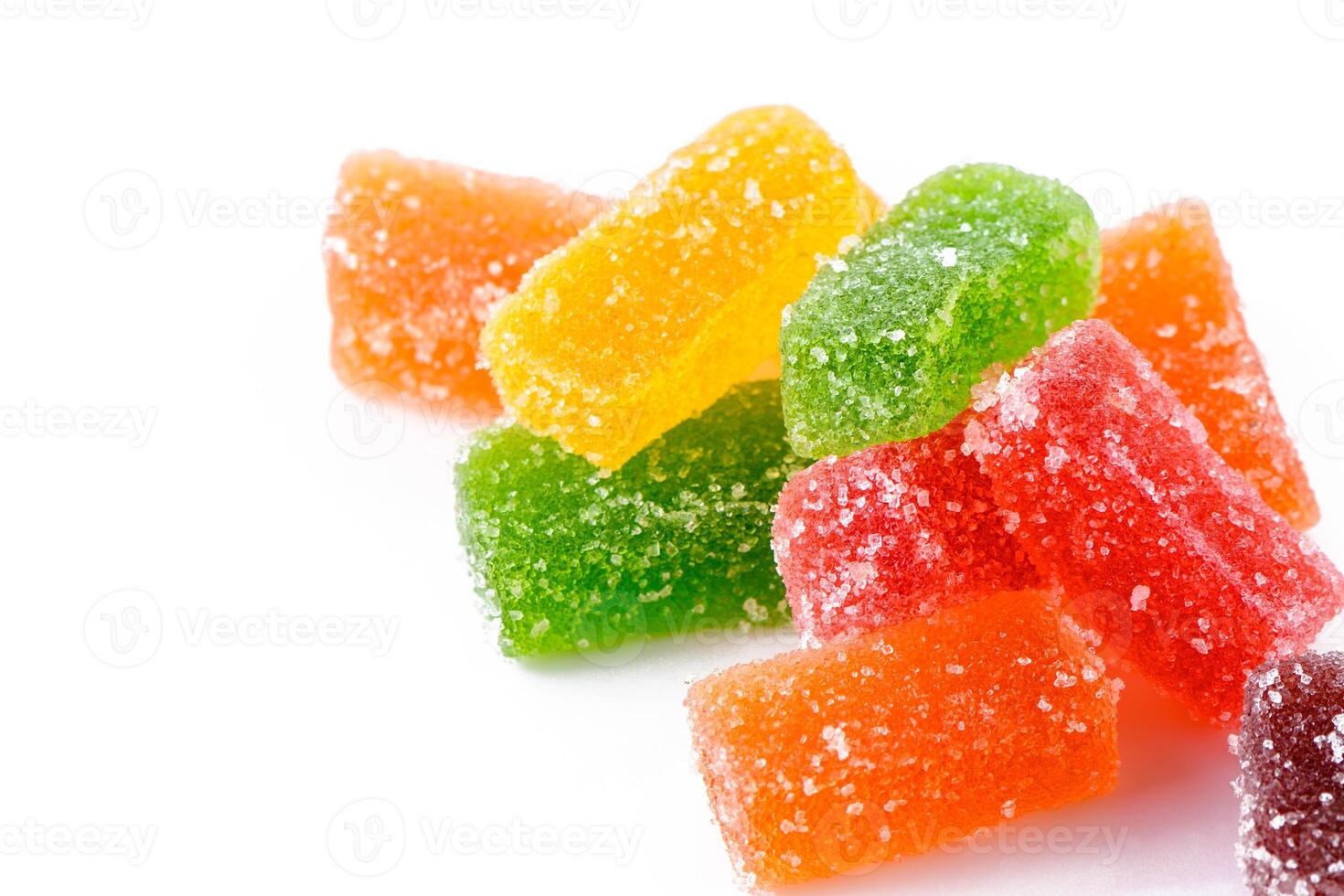 Sweet delicious multi-colored marmalade or jelly candies assorted in sugar sprinkles with fruit and berry flavor on a white background. photo