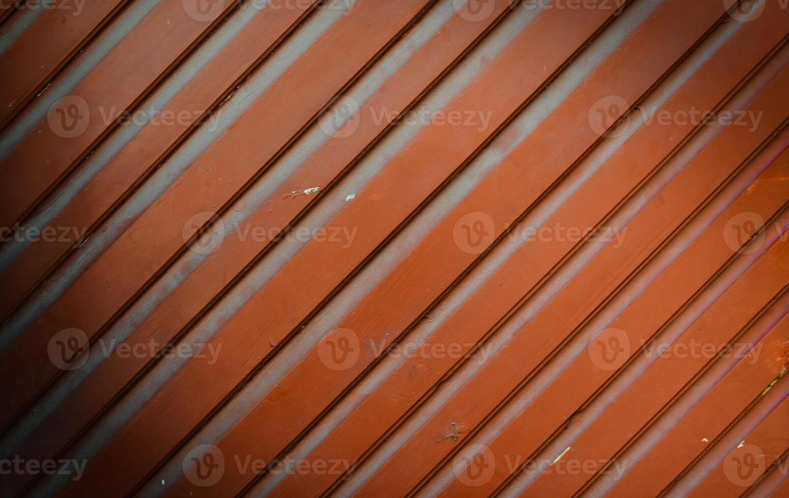 old painted red wooden background made of planks diagonally photo