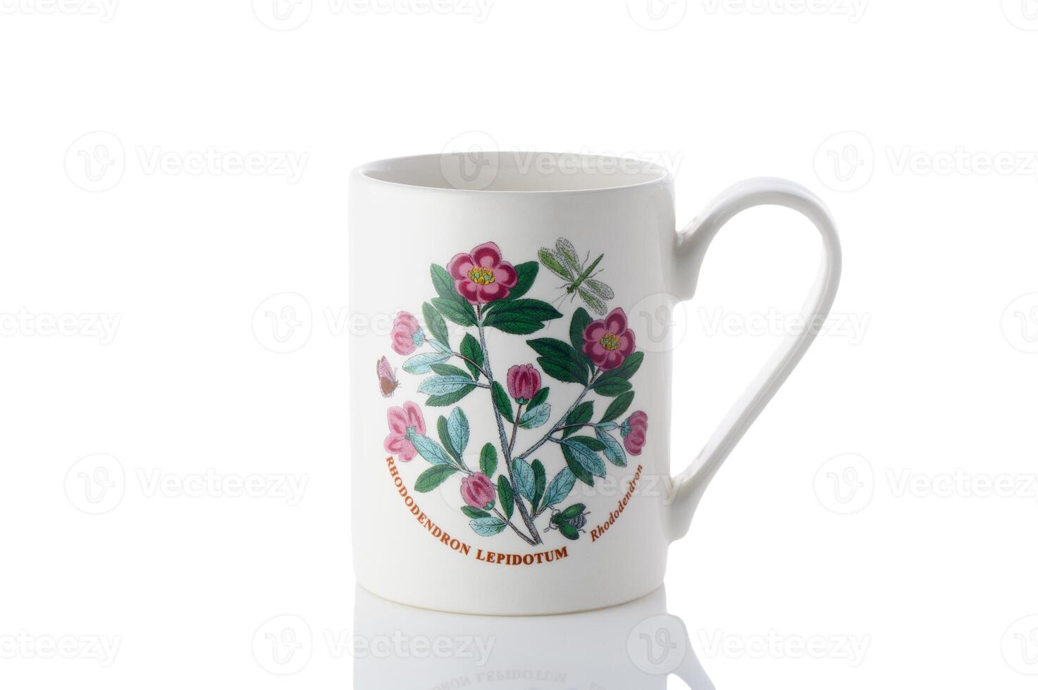 cup with a flower painted on it on a white background. Isolate photo