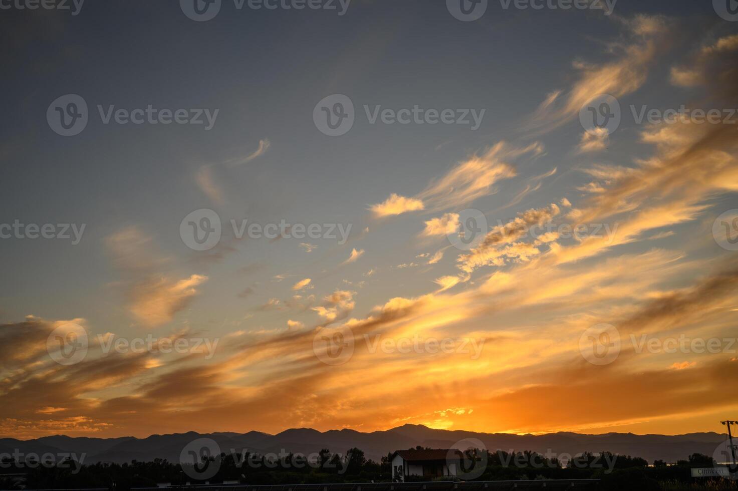 Colourful sunset sky. Full frame view of wispy colourful clouds up in the sky during sunrise or sunset hour 1 photo