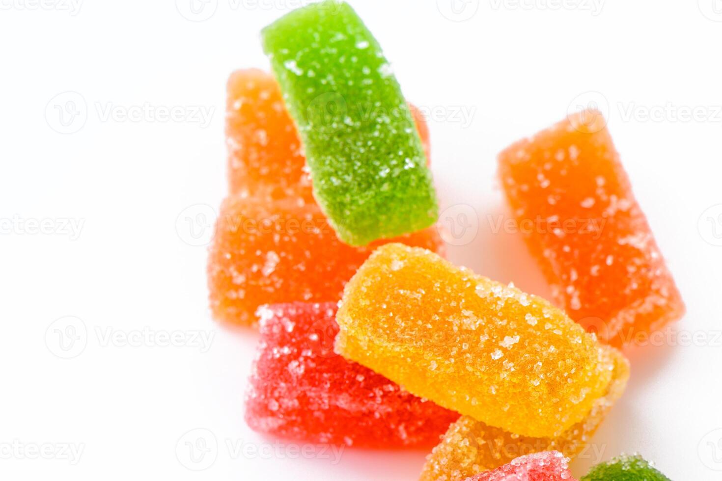 Sweet delicious multi-colored marmalade or jelly candies assorted in sugar sprinkles with fruit and berry flavor on a white background. 1 photo