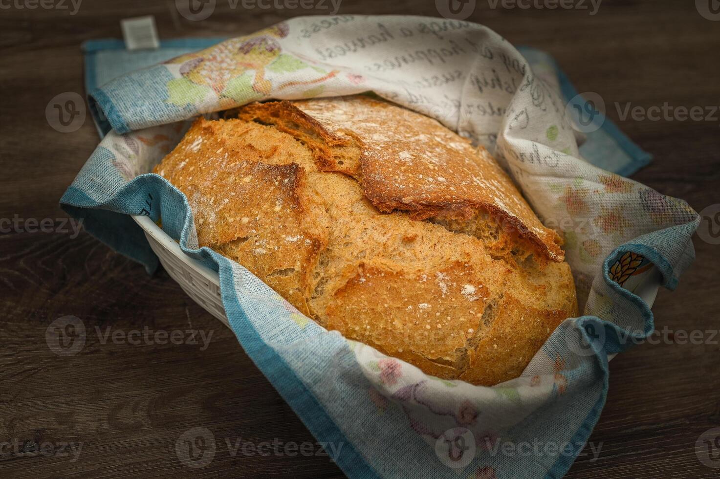 Homemade artisan bread on white wood rustic dinner table photo