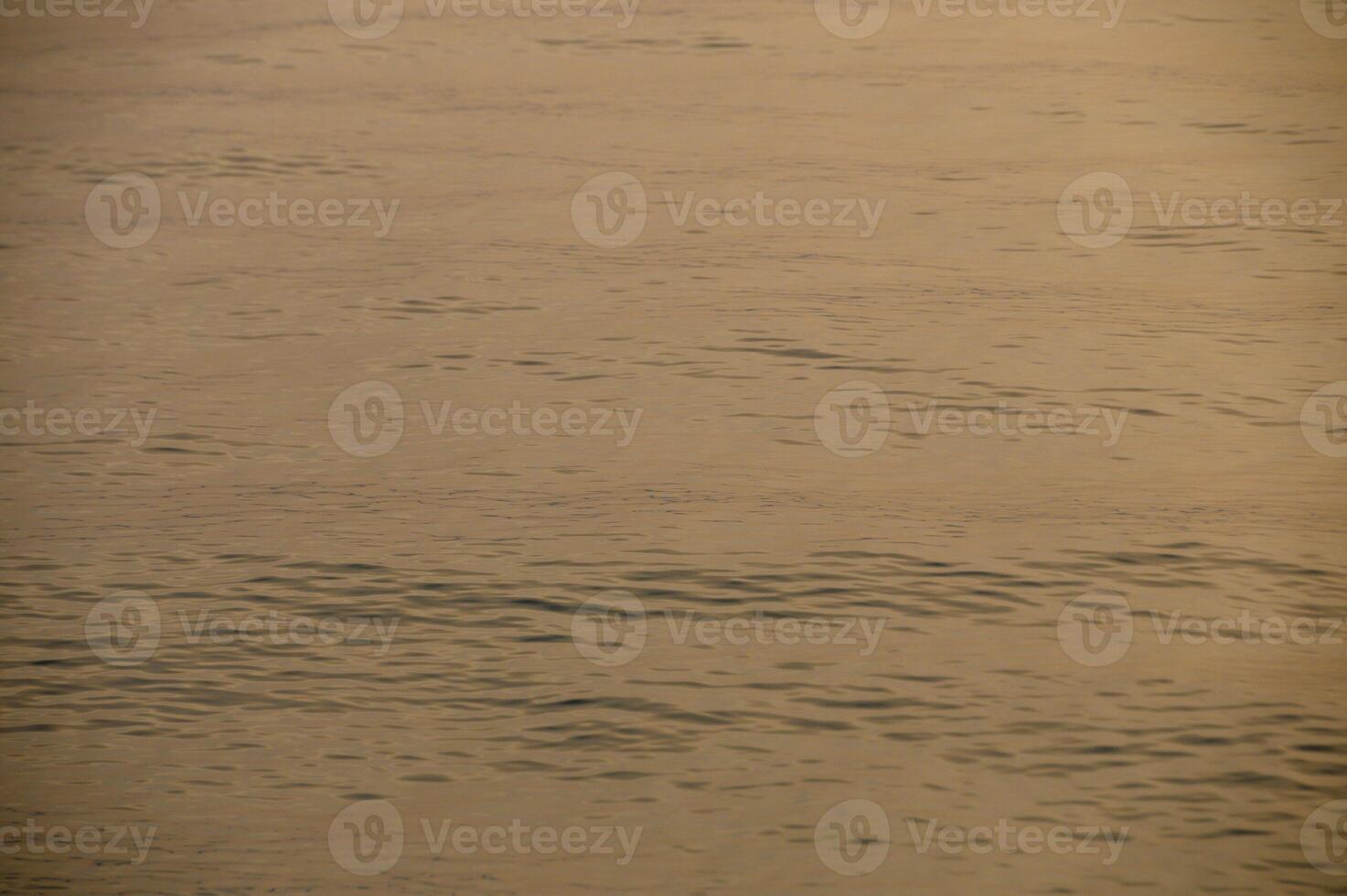 beautiful sunset of the Mediterranean sea, waves of golden color at sunset 1 photo