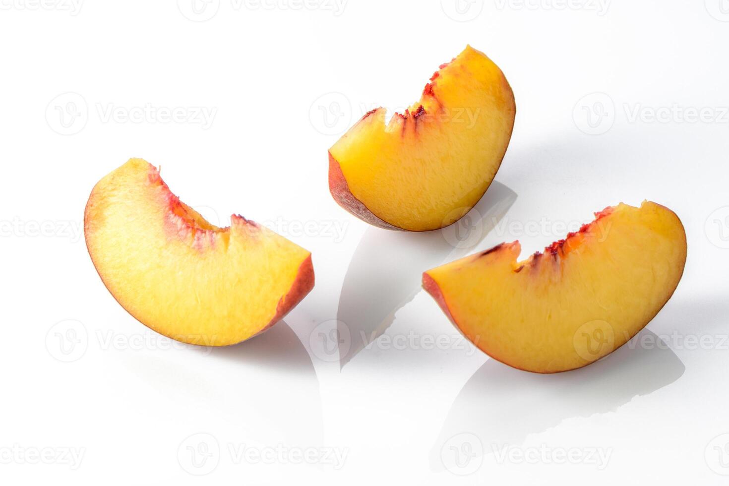 ripe nectarine with leaves isolated on white background. Top view. Flat lay pattern photo