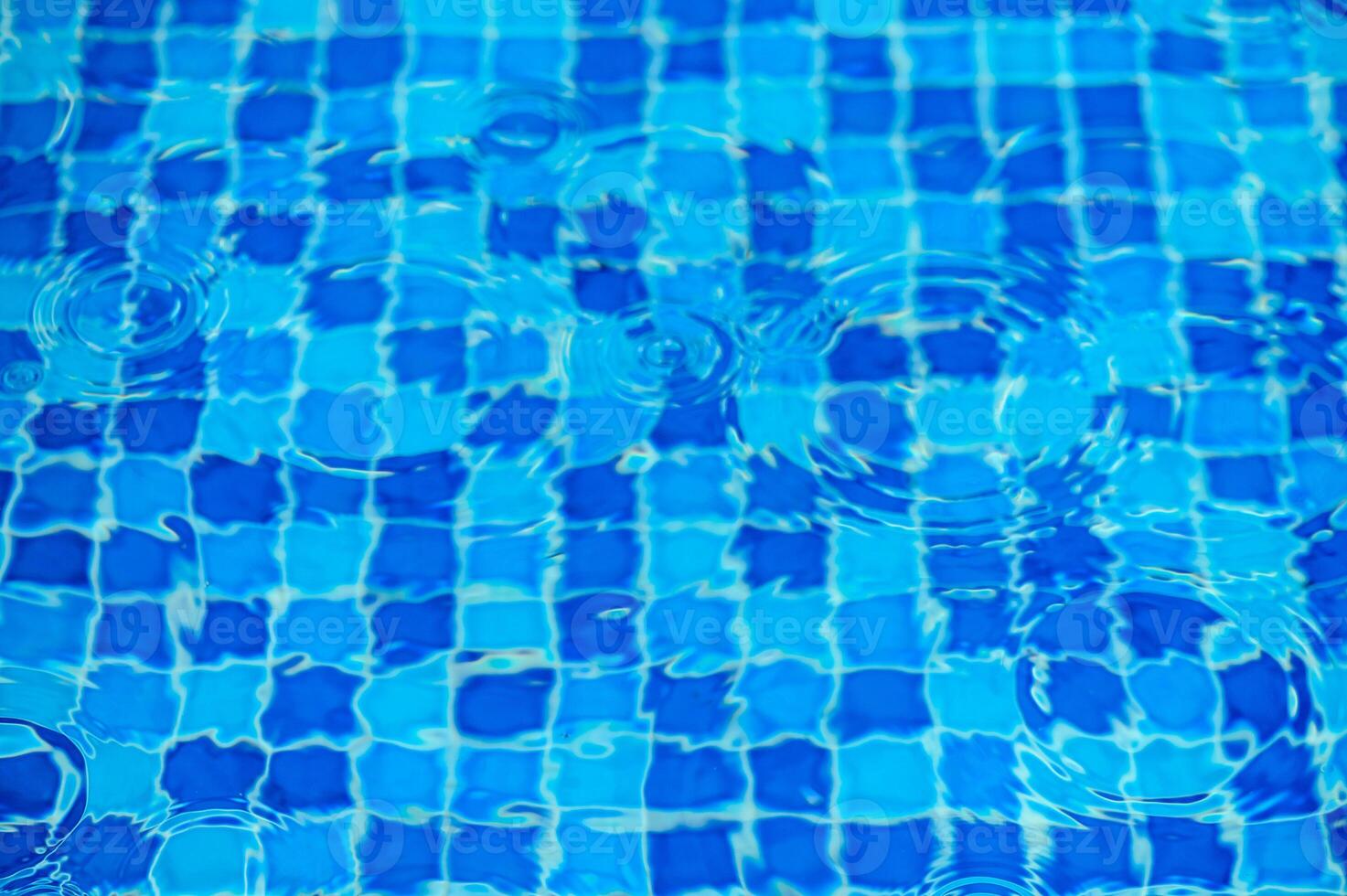 Round droplets of water over circles on pool water. Fresh water drop, whirl and splash.4 photo