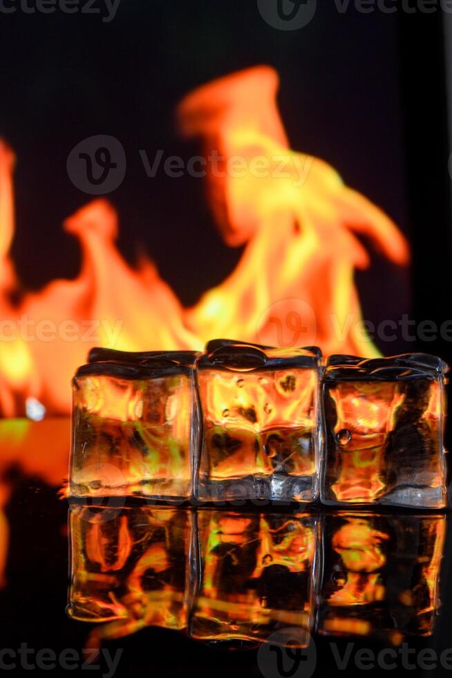 cubes of ice and fire on a water surface on an abstract background 1 photo