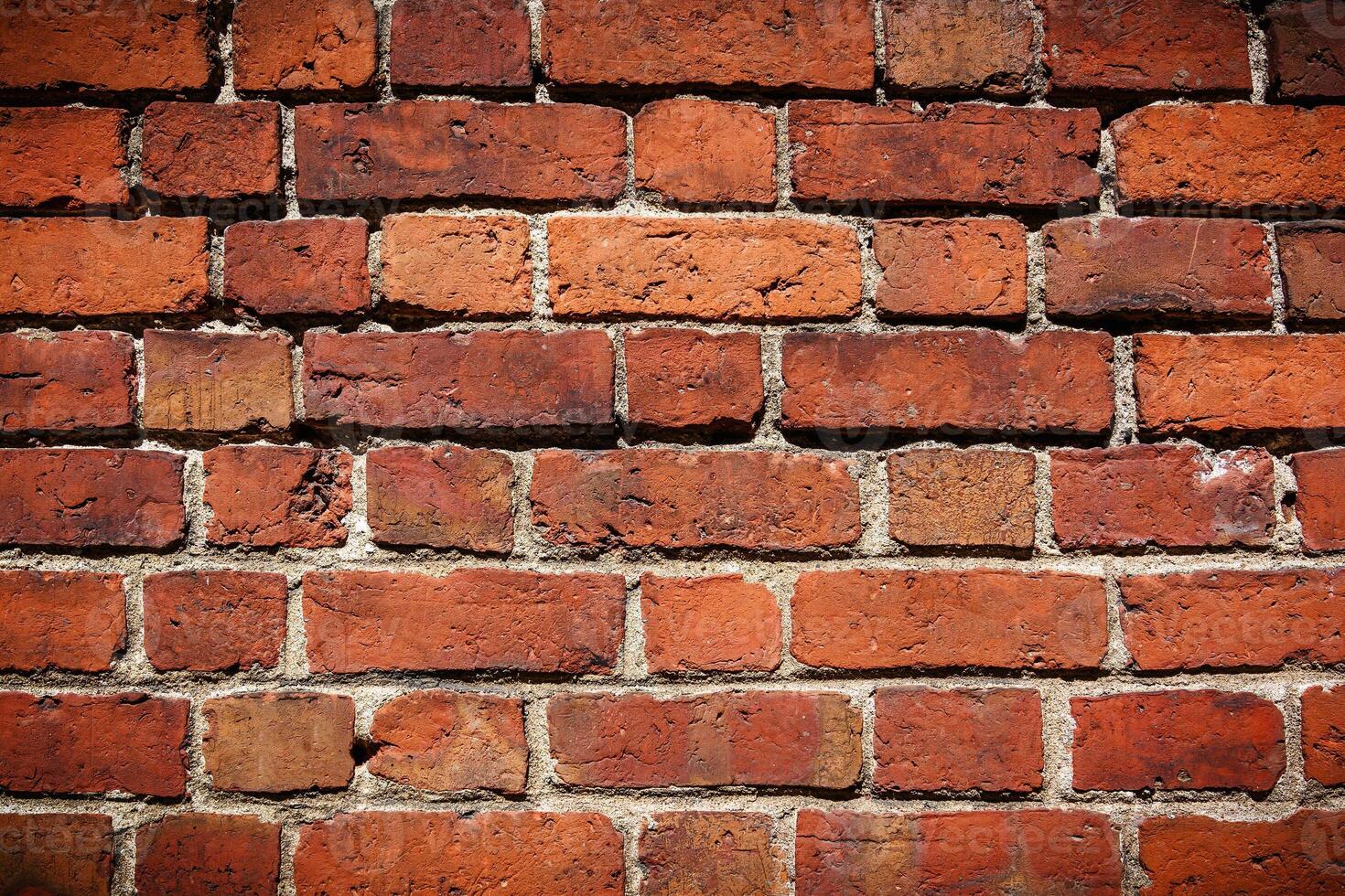 Red brick wall. Texture of old dark brown and red brick wall 2 photo