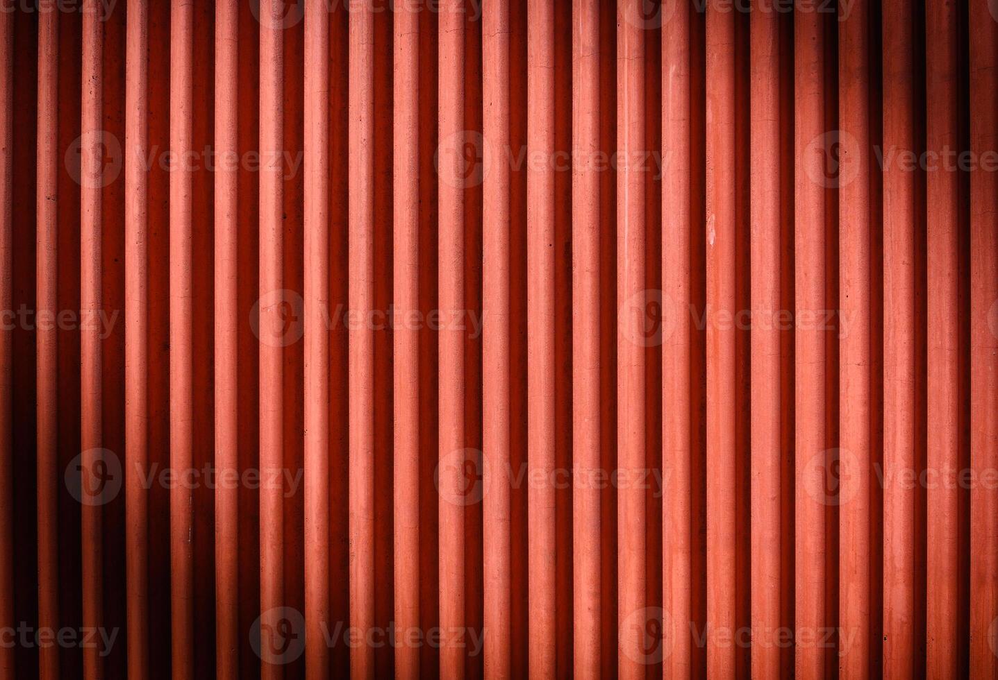 The texture of the fence made of red profiled sheet. Background. Space for text. photo