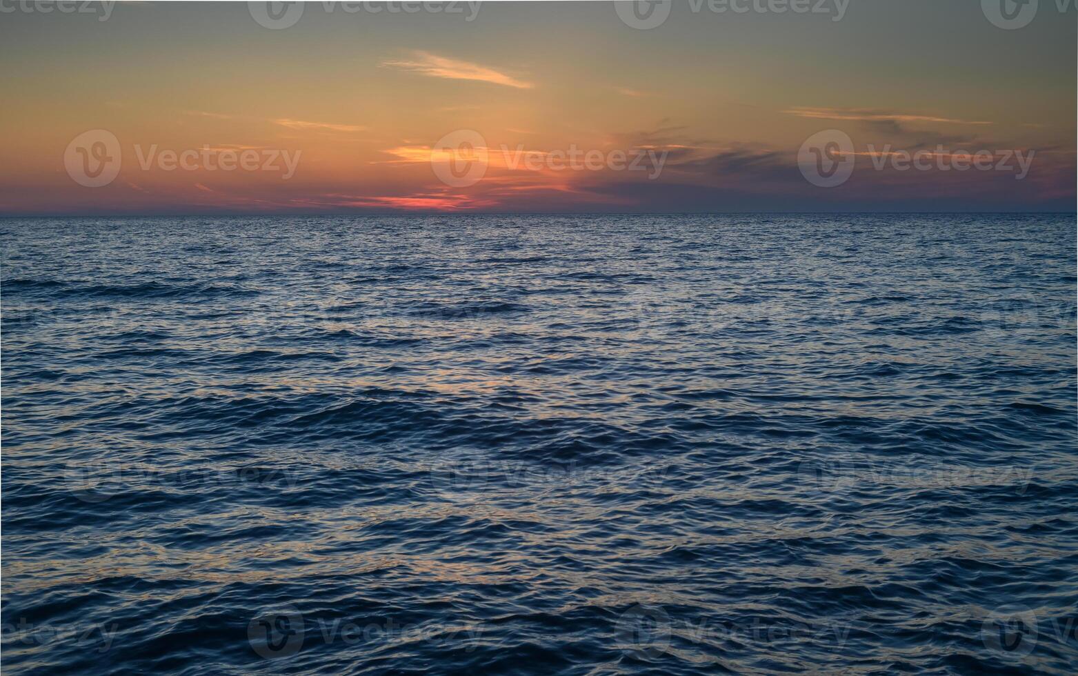 sunset and waves on the Mediterranean coast on the island of Cyprus photo