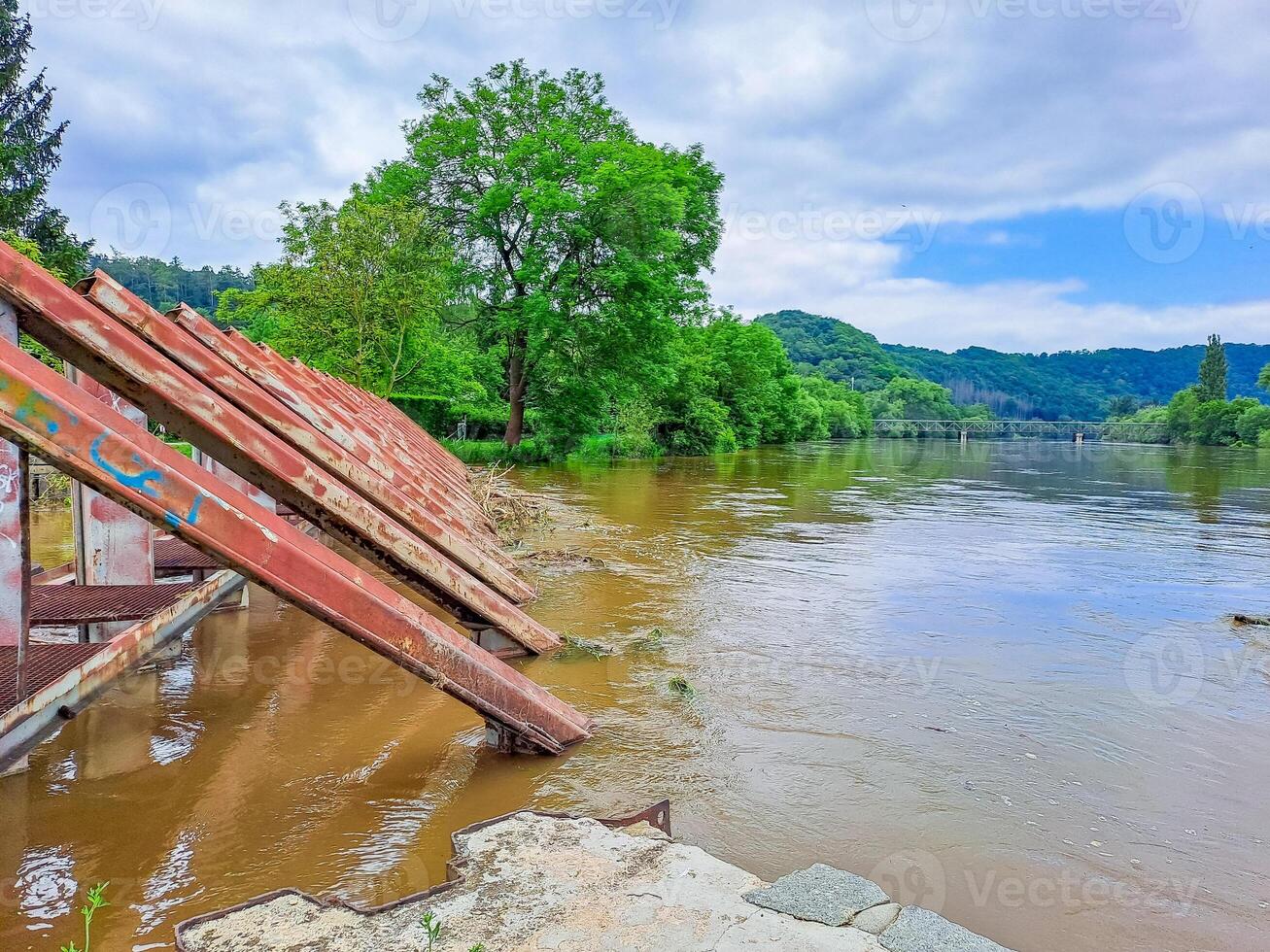 The river Berunka swollen after heavy rainfall and flood water crashing valley photo