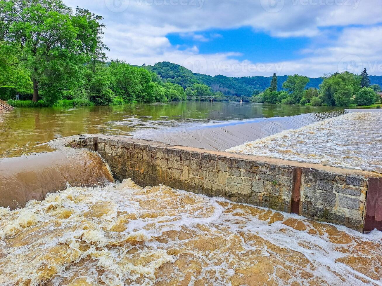 The river Berunka swollen after heavy rainfall and flood water crashing valley photo