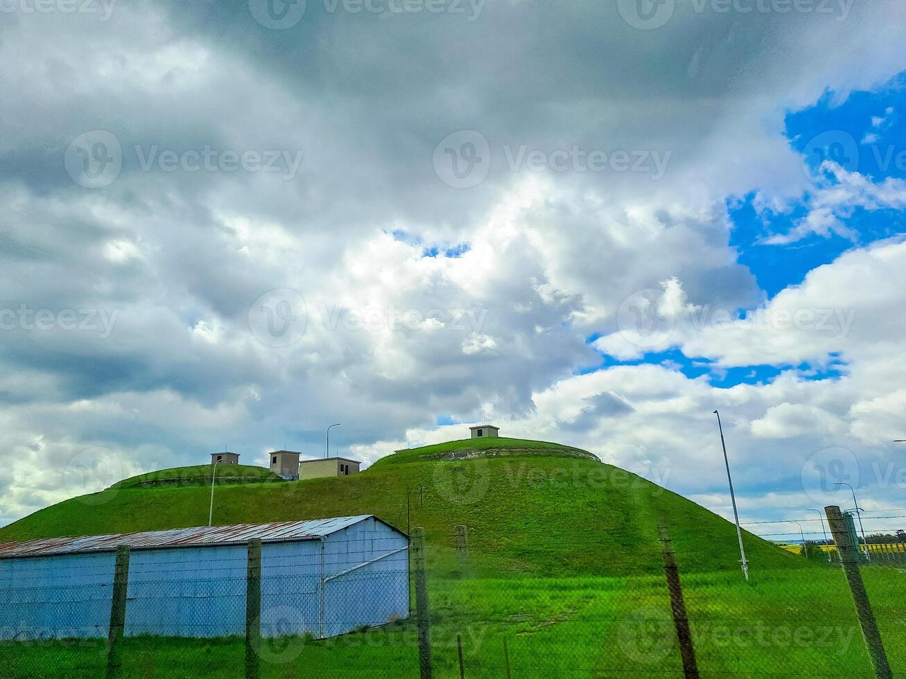 Basement in the grass for storing grain or other vegetables and fruits photo