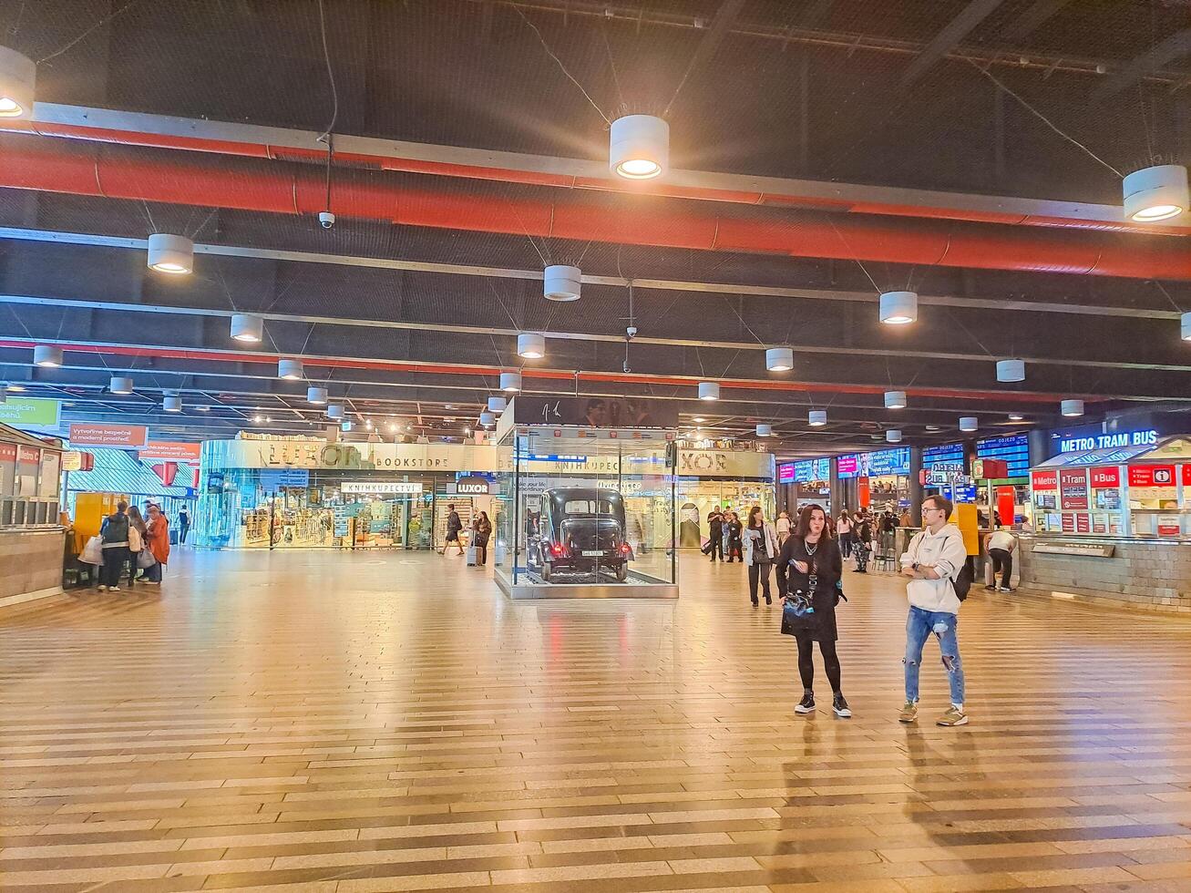 Prague- Czech- 12 June 2024. Travellers waiting on a train in departure hall photo