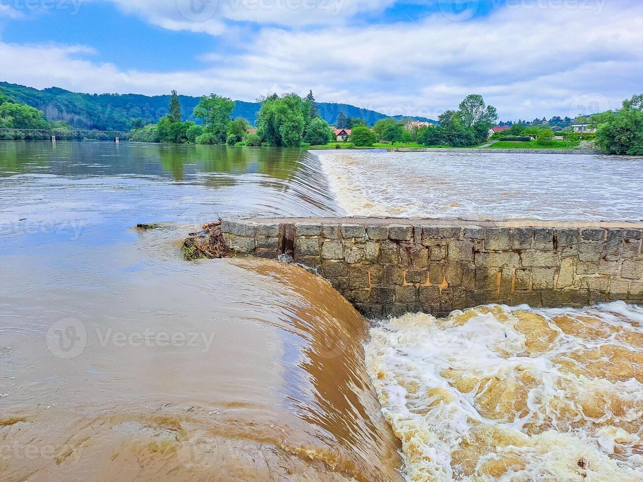 The river Berunka swollen after heavy rainfall and flood water crashing valley photo