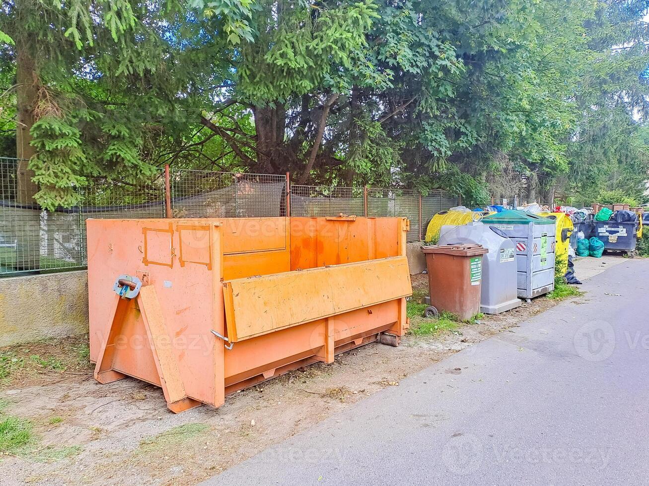 Dumpsters being full with garbage. Trash can overflowing litter pollution photo
