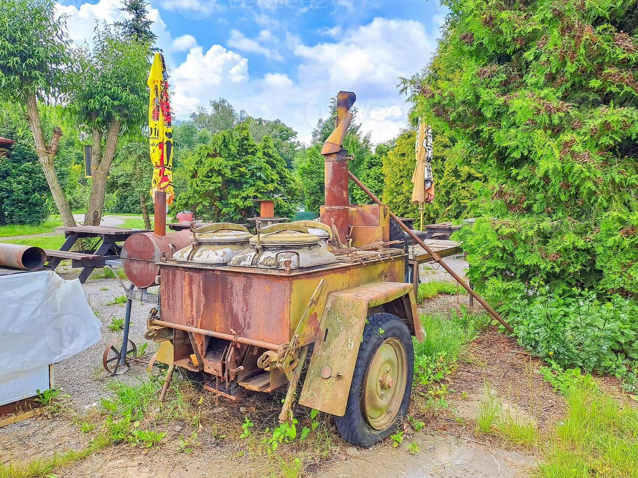 Military field kitchen of World War II is installed in the park for cooking photo