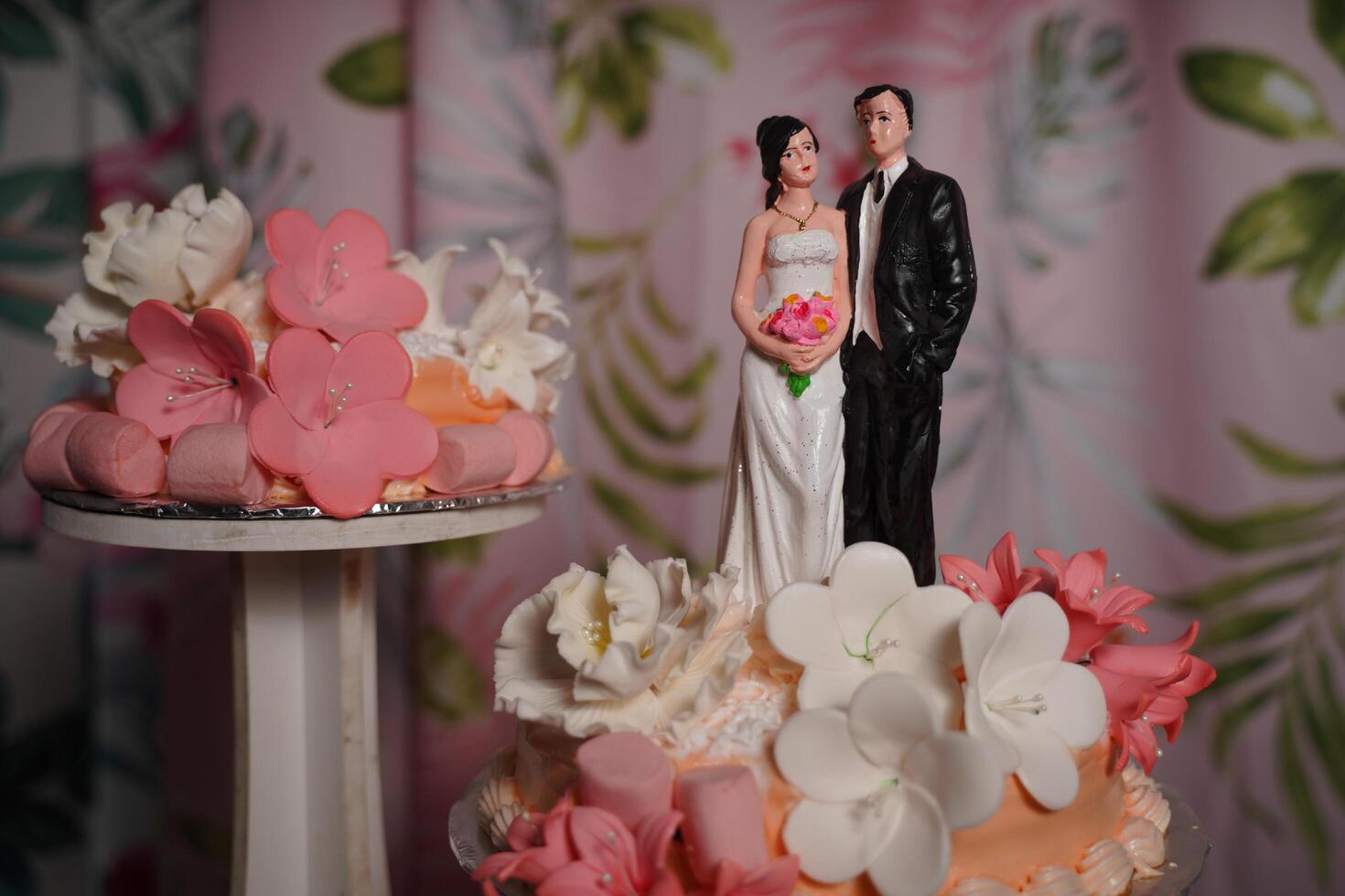 a cake with a couple on top and a cake topper photo