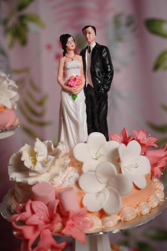 a cake with a couple on it photo