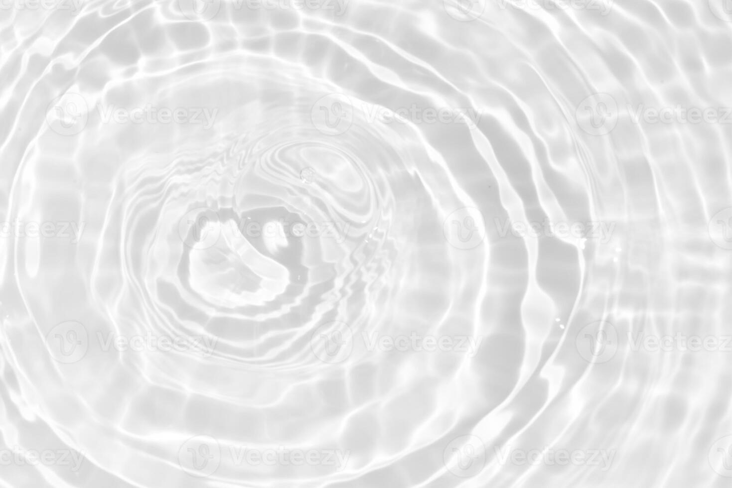 Blue water with ripples on the surface. Defocus blurred transparent blue colored clear calm water surface texture with splashes and bubbles. Water waves with shining pattern texture background. photo