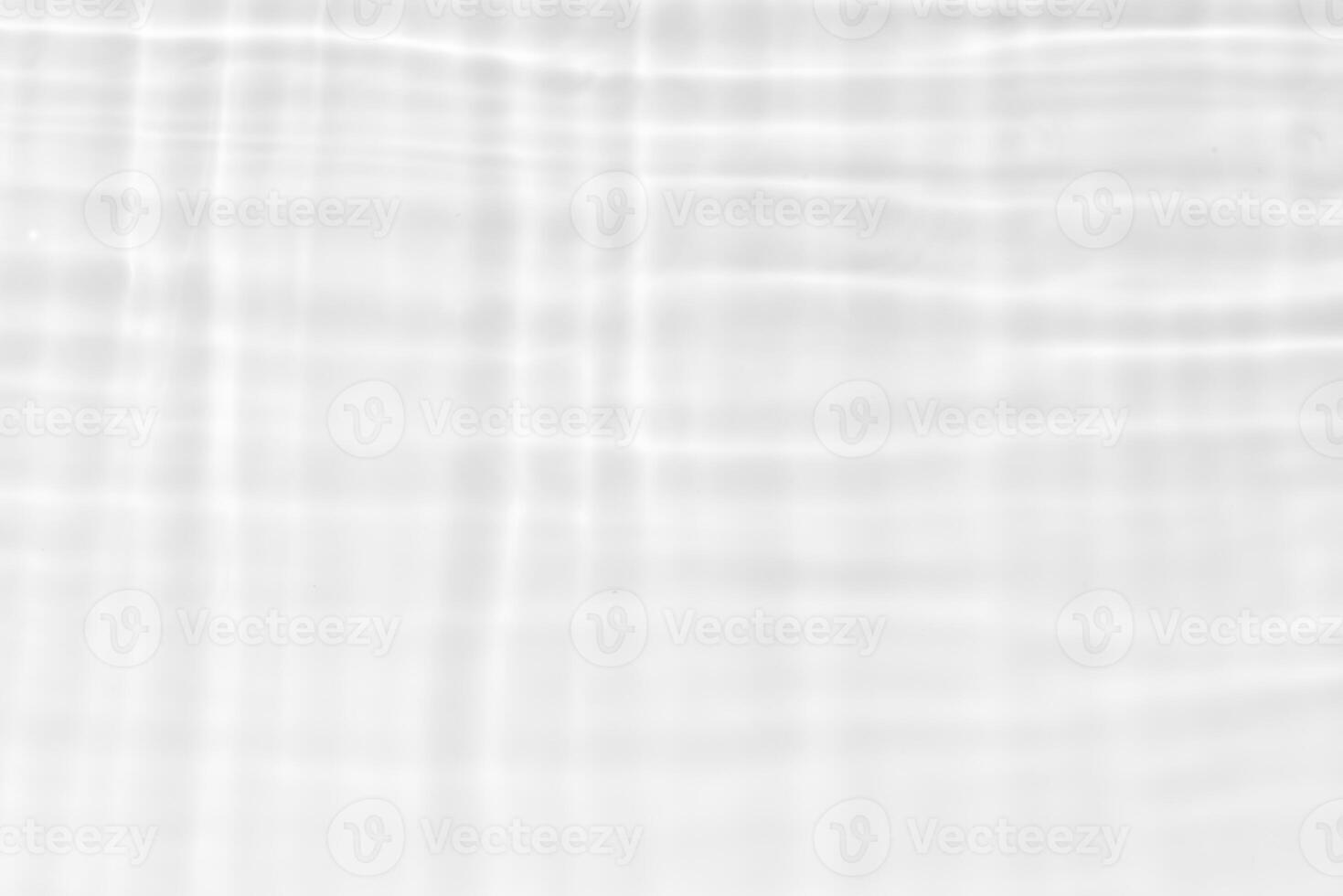 Blue water with ripples on the surface. Defocus blurred transparent blue colored clear calm water surface texture with splashes and bubbles. Water waves with shining pattern texture background. photo