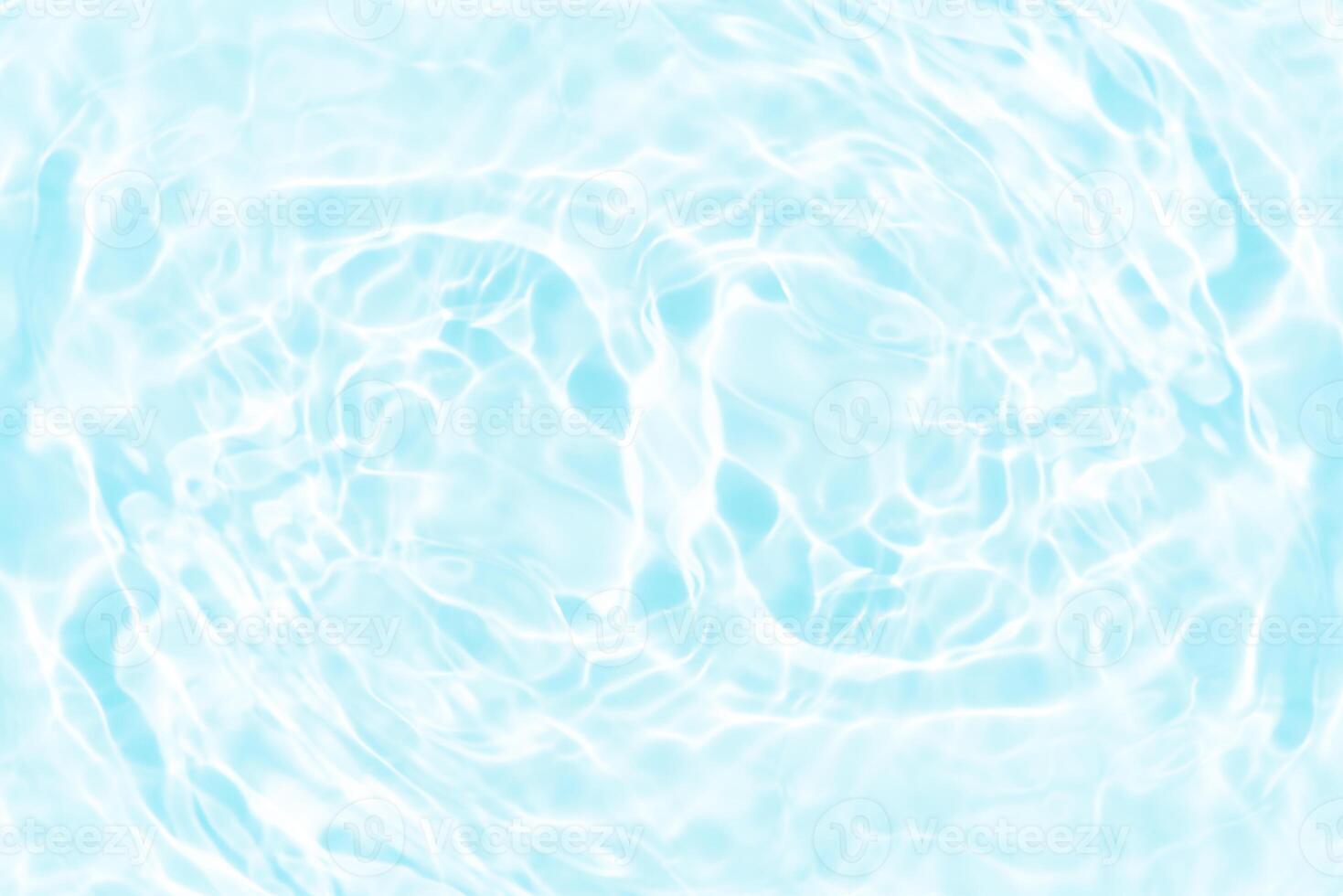 Blue water with ripples on the surface. Defocus blurred transparent blue colored clear calm water surface texture with splashes and bubbles. Water waves with shining pattern texture background. photo
