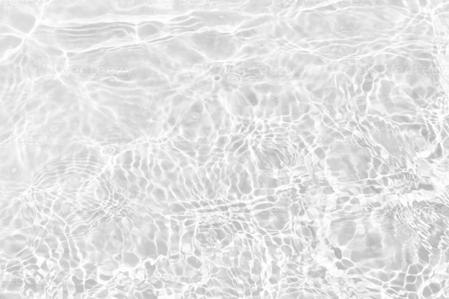Blue water with ripples on the surface. Defocus blurred transparent blue colored clear calm water surface texture with splashes and bubbles. Water waves with shining pattern texture background. photo