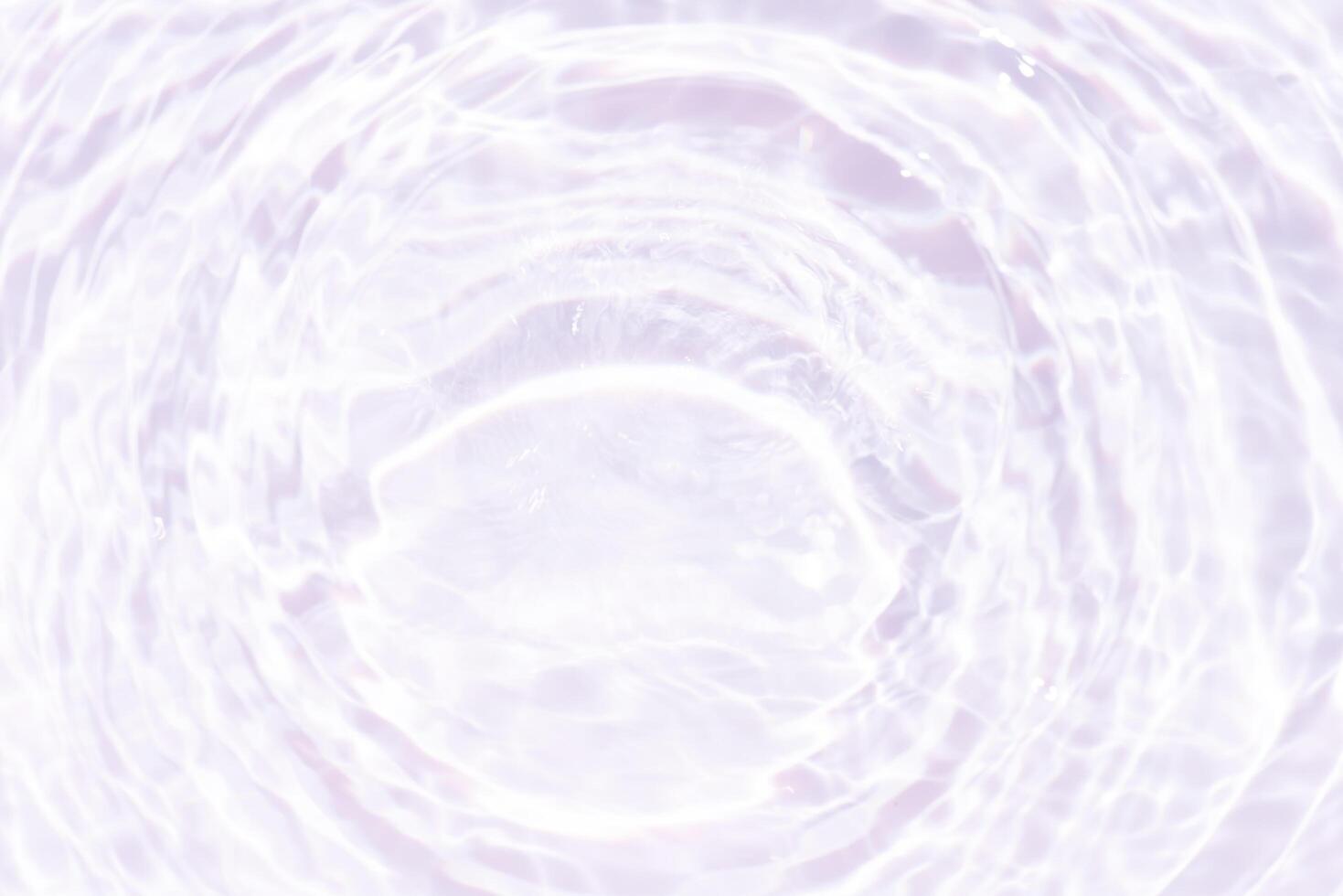 Blue water with ripples on the surface. Defocus blurred transparent blue colored clear calm water surface texture with splashes and bubbles. Water waves with shining pattern texture background. photo