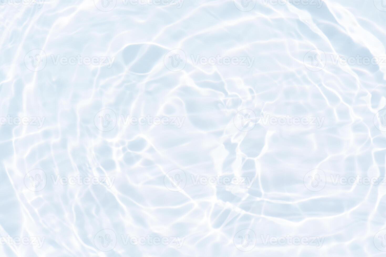 Blue water with ripples on the surface. Defocus blurred transparent blue colored clear calm water surface texture with splashes and bubbles. Water waves with shining pattern texture background. photo