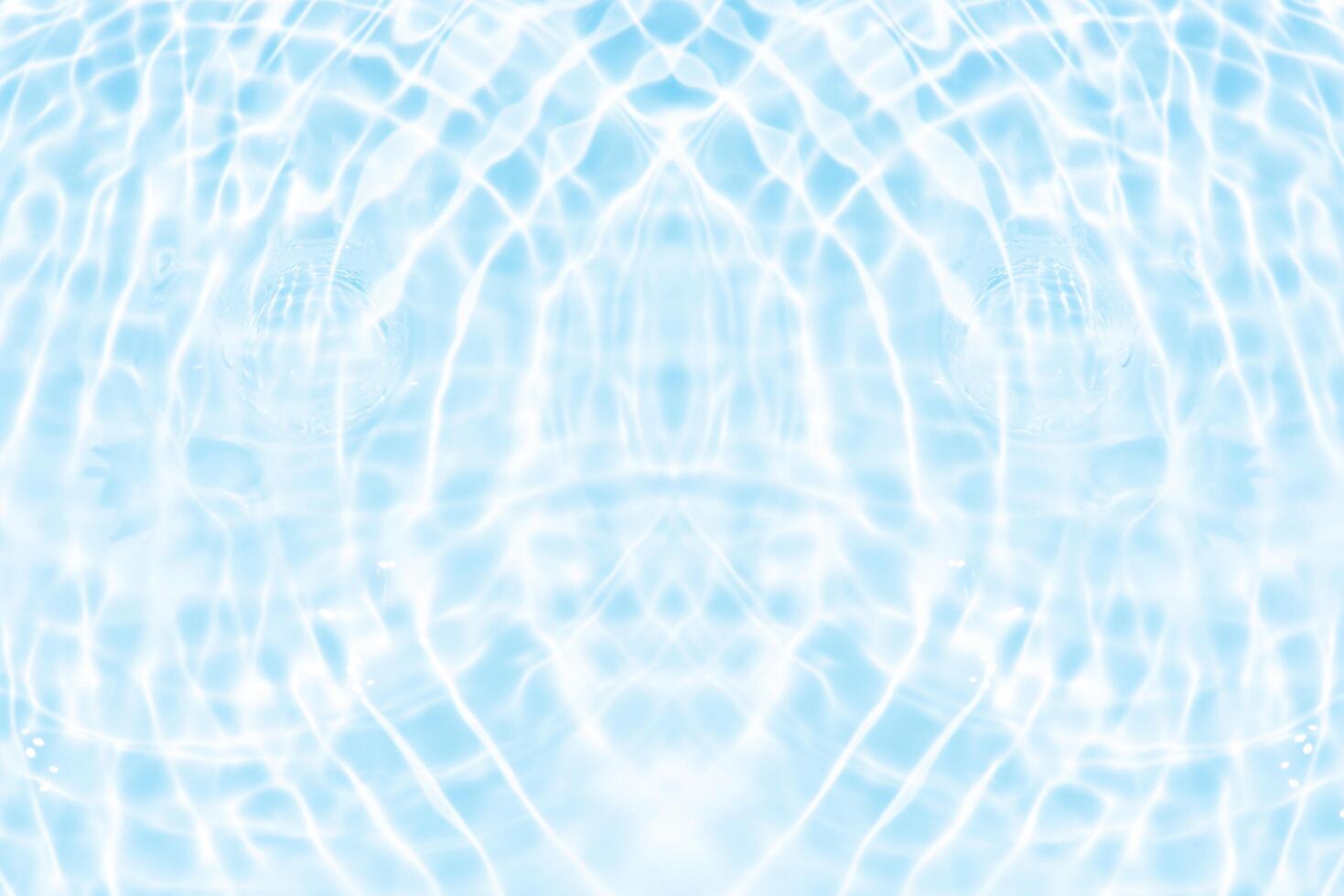 Bluewater waves on the surface ripples blurred. Defocus blurred transparent blue colored clear calm water surface texture with splash and bubbles. Water waves with shining pattern texture background. photo
