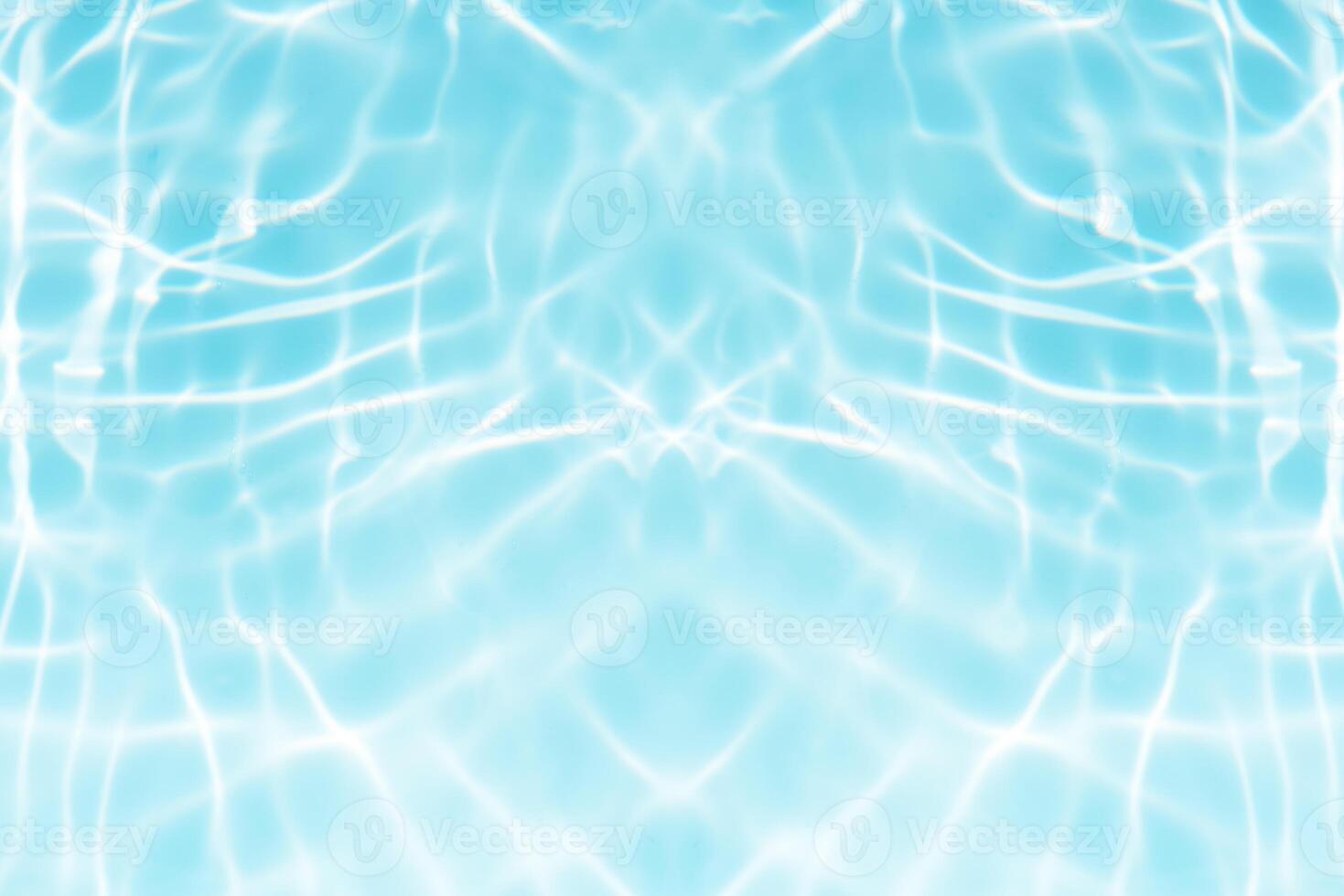 Bluewater waves on the surface ripples blurred. Defocus blurred transparent blue colored clear calm water surface texture with splash and bubbles. Water waves with shining pattern texture background. photo