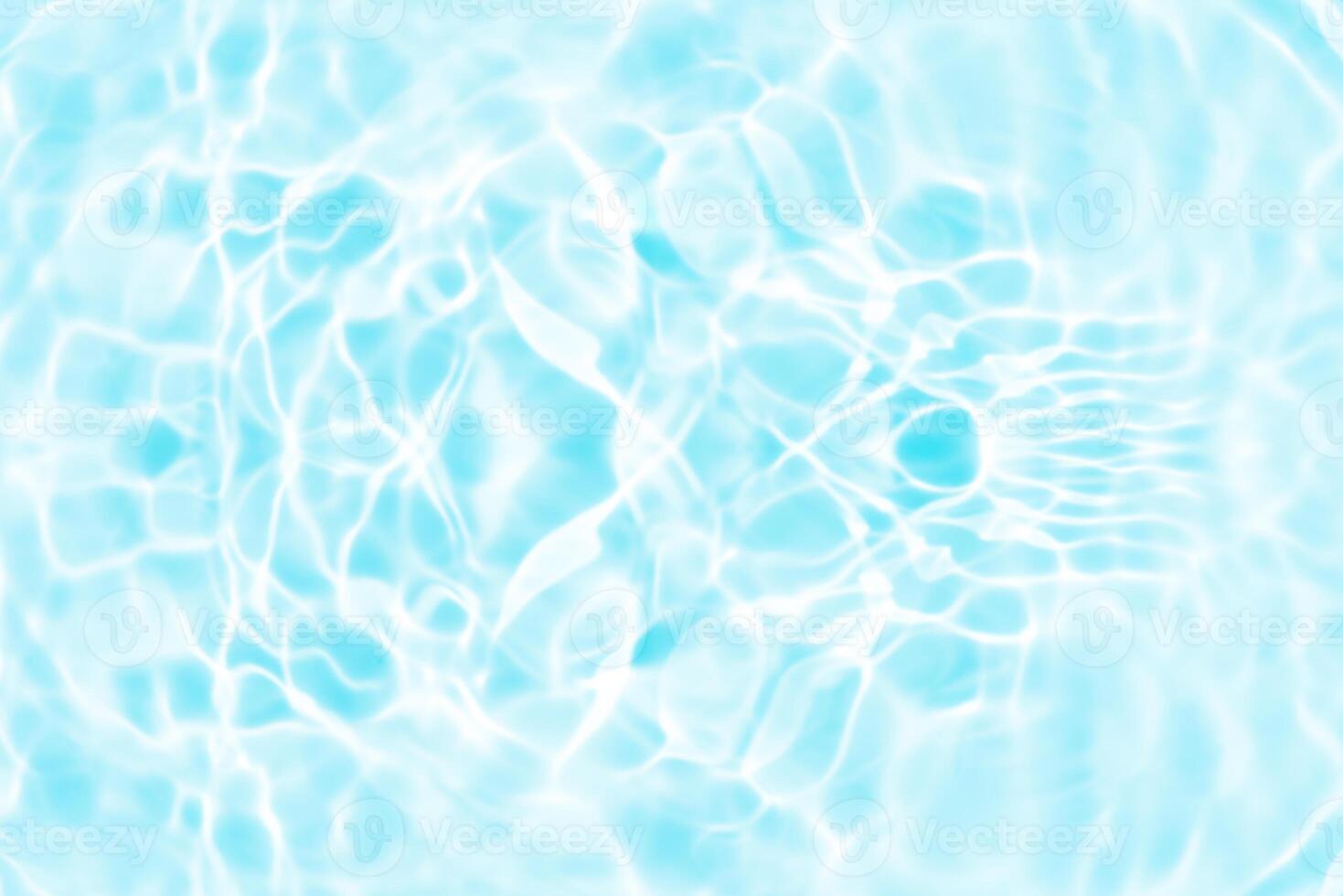 Blue water with ripples on the surface. Defocus blurred transparent blue colored clear calm water surface texture with splashes and bubbles. Water waves with shining pattern texture background. photo