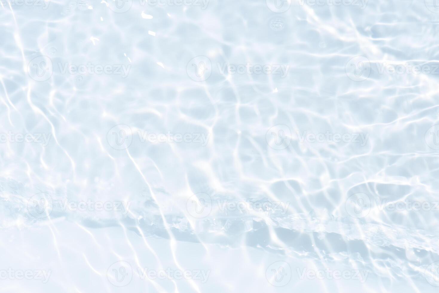 Blue water with ripples on the surface. Defocus blurred transparent blue colored clear calm water surface texture with splashes and bubbles. Water waves with shining pattern texture background. photo