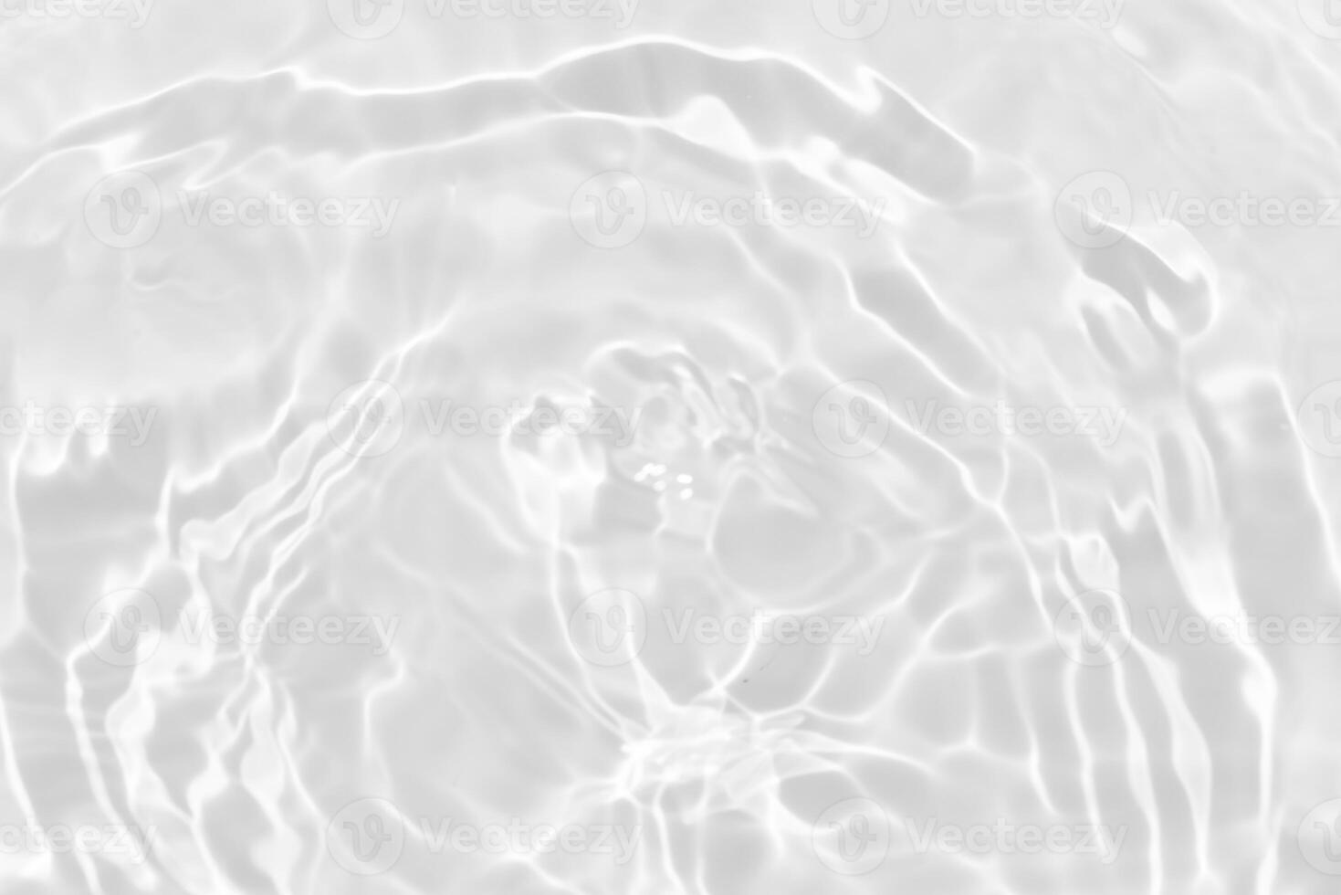 Blue water with ripples on the surface. Defocus blurred transparent blue colored clear calm water surface texture with splashes and bubbles. Water waves with shining pattern texture background. photo