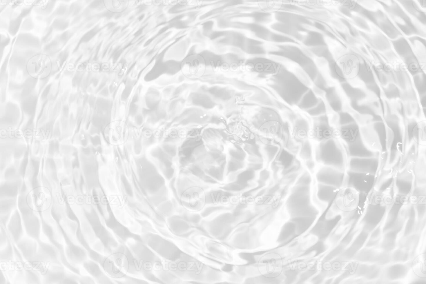 Bluewater waves on the surface ripples blurred. Defocus blurred transparent blue colored clear calm water surface texture with splash and bubbles. Water waves with shining pattern texture background. photo
