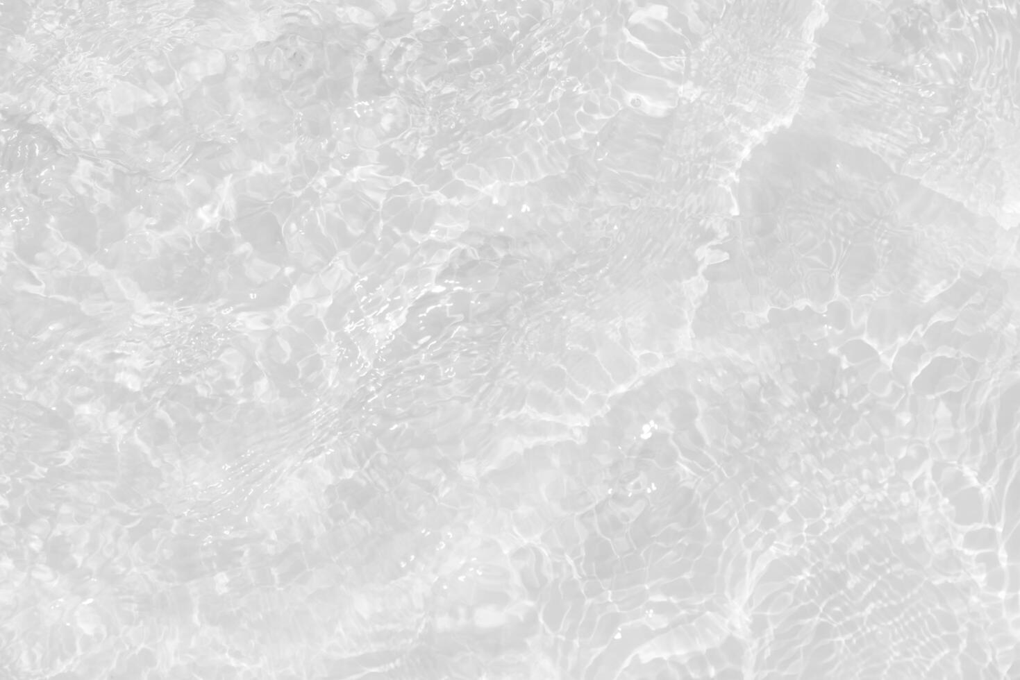 Bluewater waves on the surface ripples blurred. Defocus blurred transparent blue colored clear calm water surface texture with splash and bubbles. Water waves with shining pattern texture background. photo