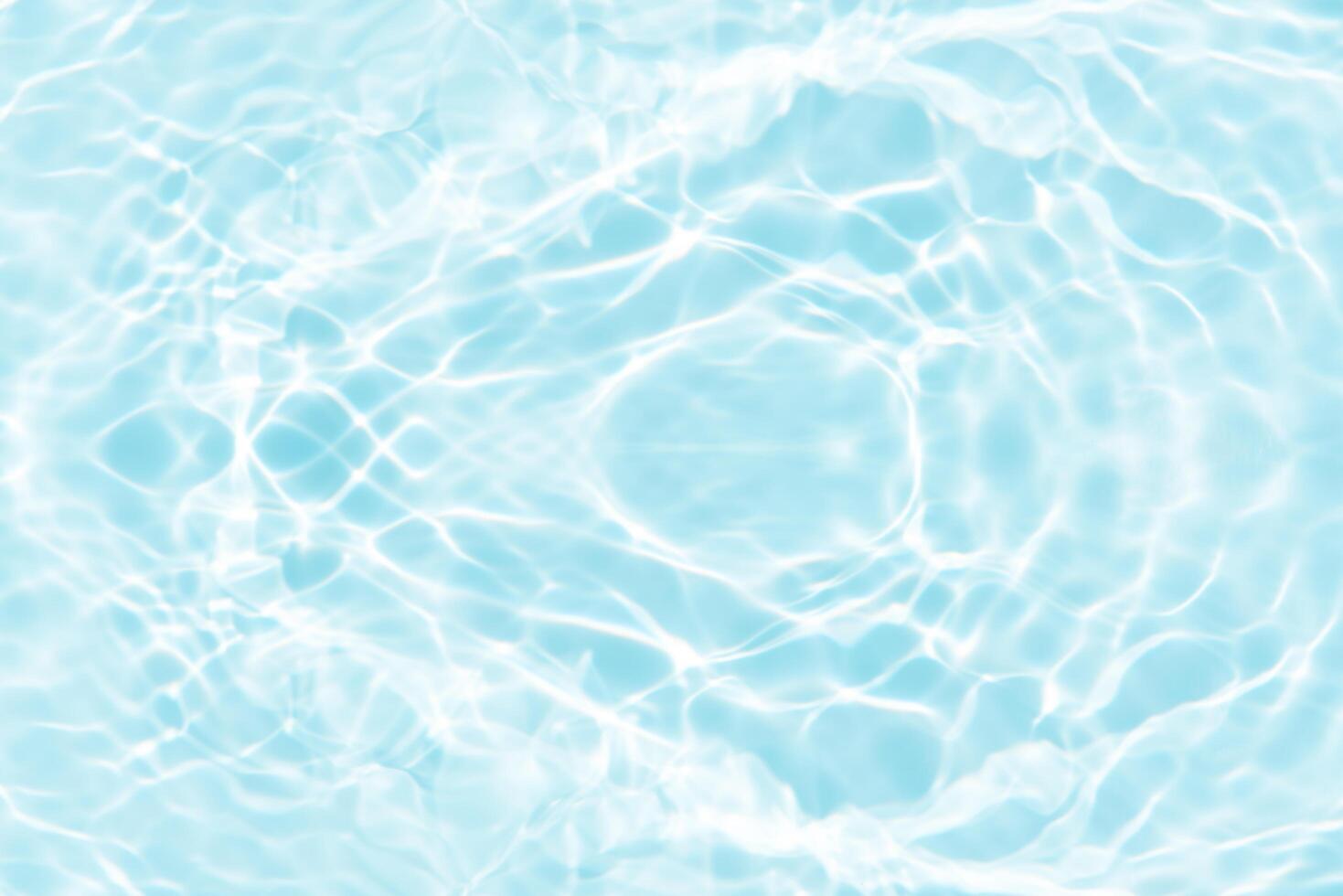 Bluewater waves on the surface ripples blurred. Defocus blurred transparent blue colored clear calm water surface texture with splash and bubbles. Water waves with shining pattern texture background. photo