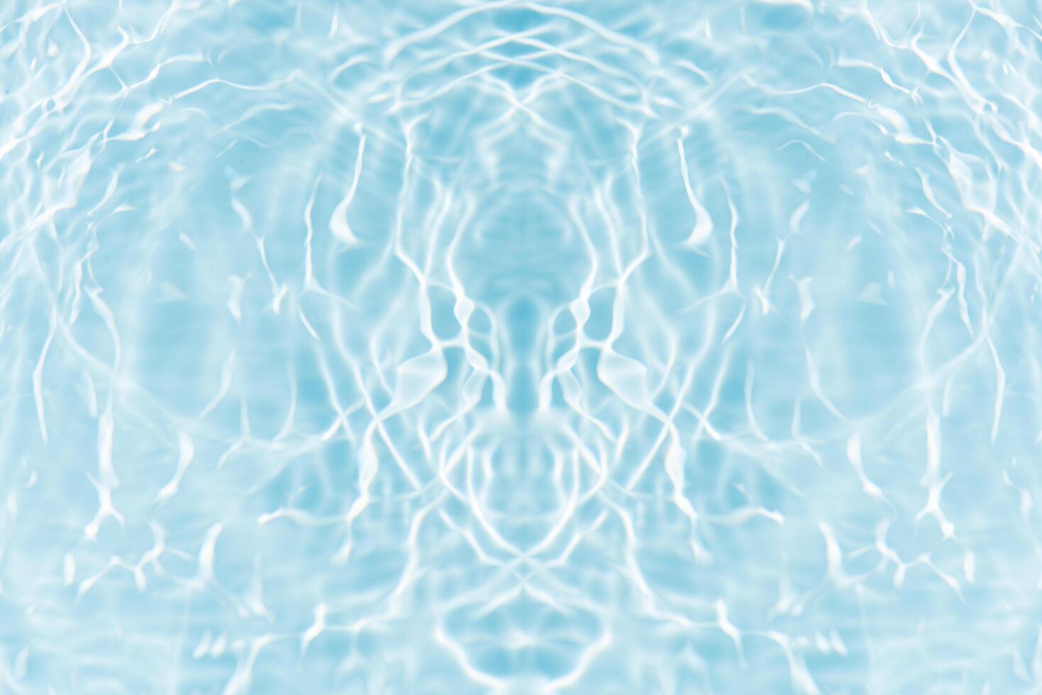 Bluewater waves on the surface ripples blurred. Defocus blurred transparent blue colored clear calm water surface texture with splash and bubbles. Water waves with shining pattern texture background. photo