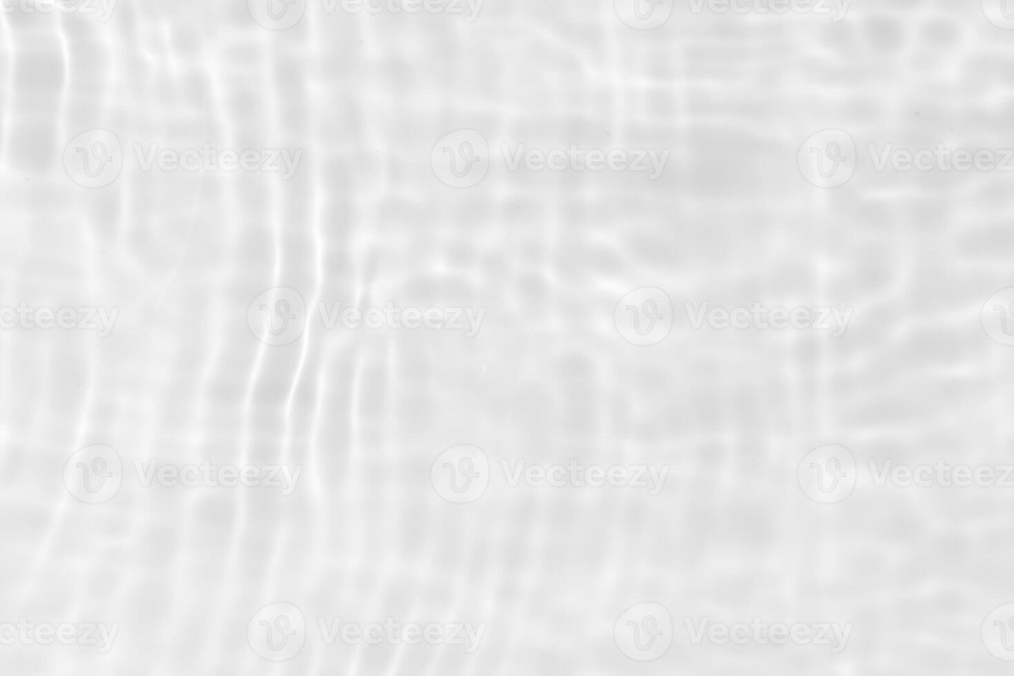 Bluewater waves on the surface ripples blurred. Defocus blurred transparent blue colored clear calm water surface texture with splash and bubbles. Water waves with shining pattern texture background. photo