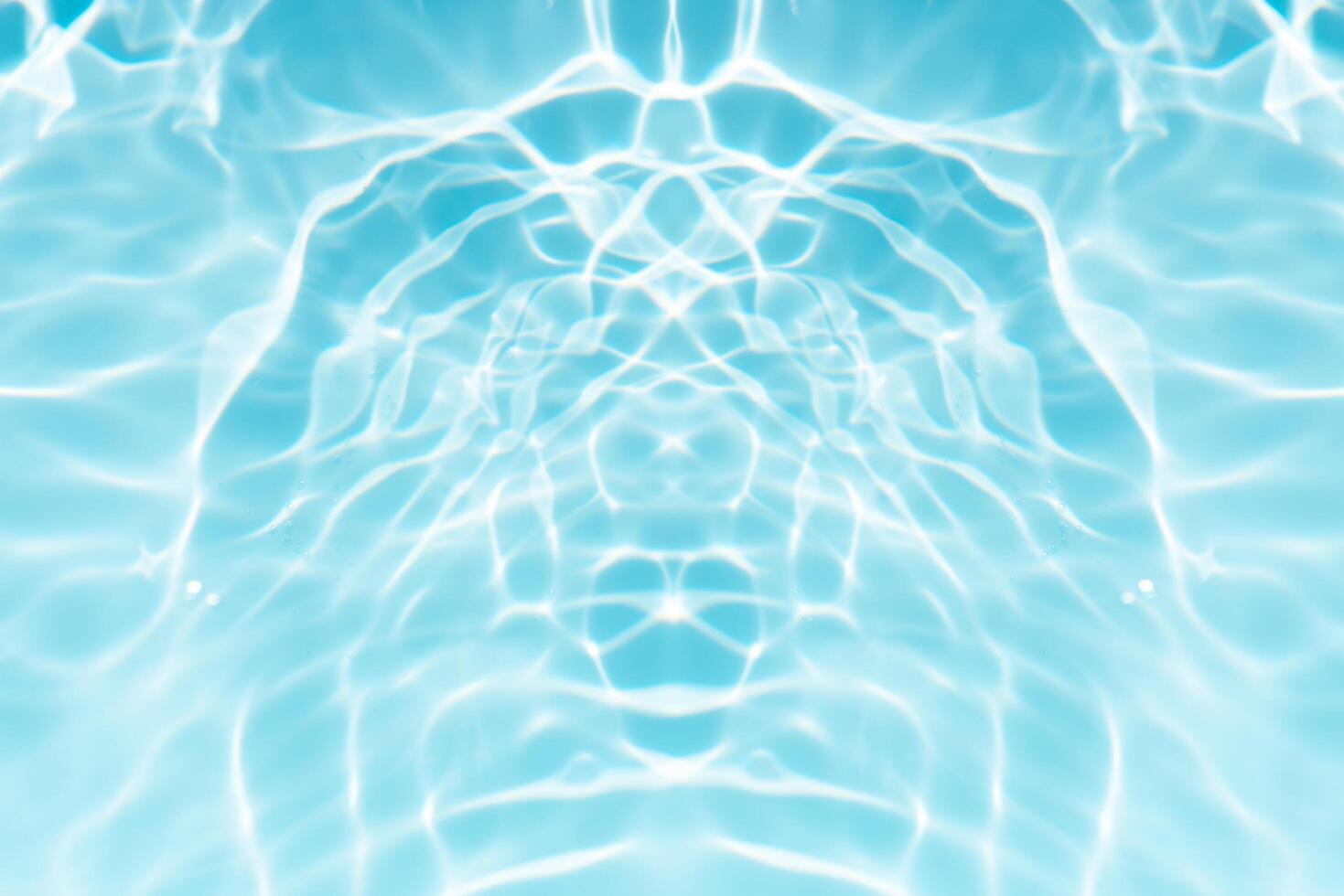 Blue sea waves on the surface ripples blurred. Defocus blurred transparent blue colored clear calm water surface texture with splash and bubbles. Water waves with shining pattern texture background. photo