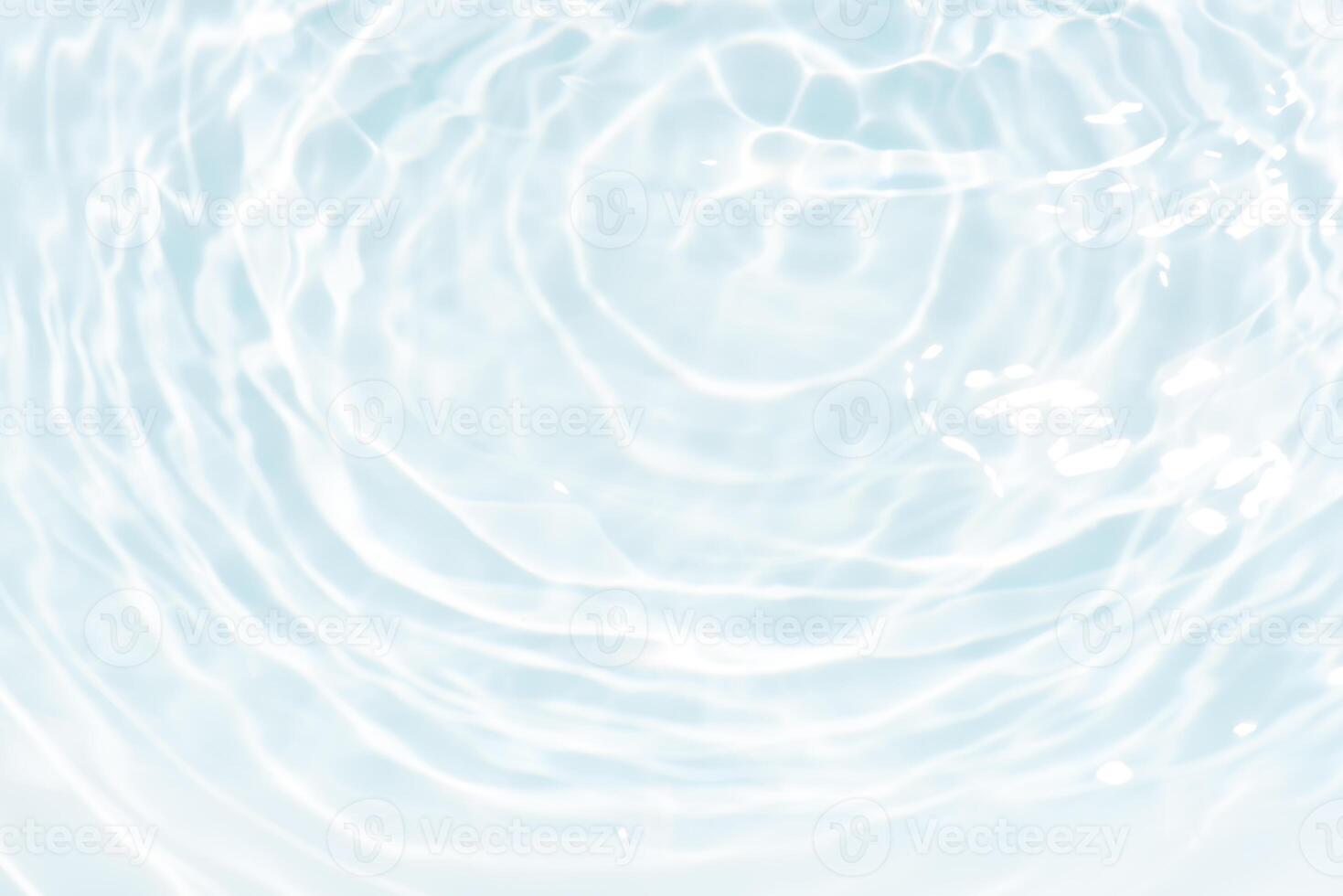 Blue water with ripples on the surface. Defocus blurred transparent blue colored clear calm water surface texture with splashes and bubbles. Water waves with shining pattern texture background. photo