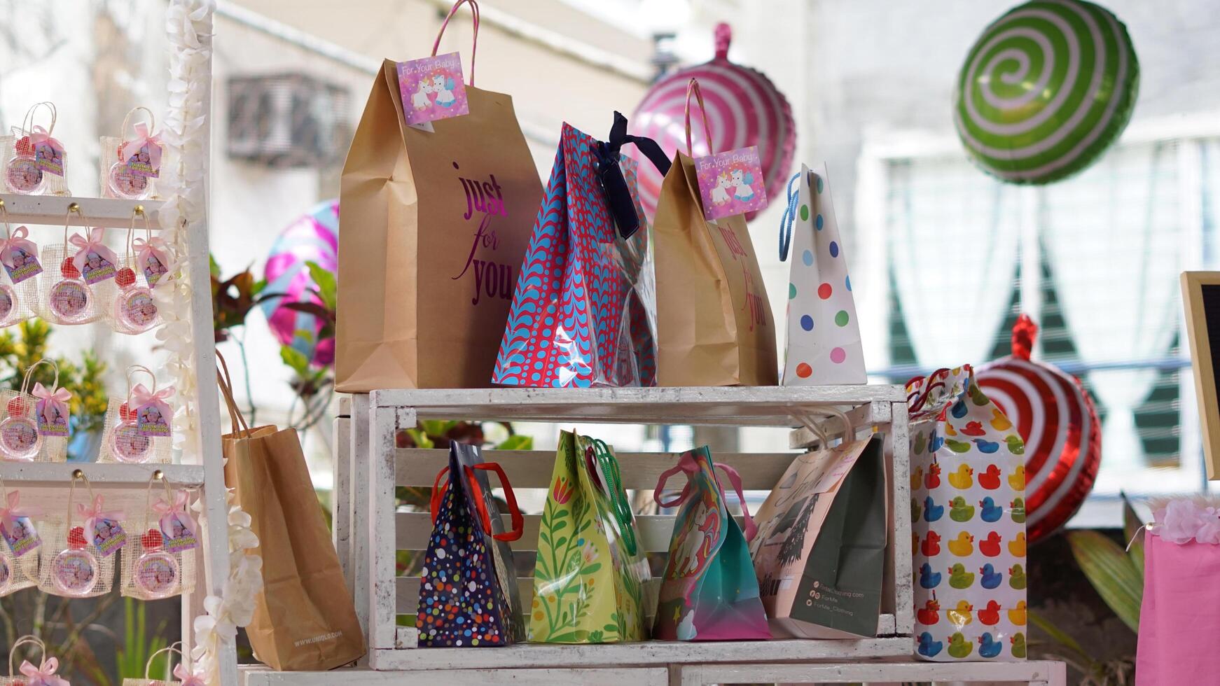 a display of bags and other items on a shelf photo