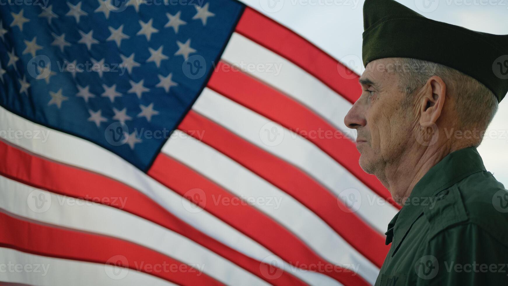 Veteran Stand Against The American Flag For Memorial Day photo