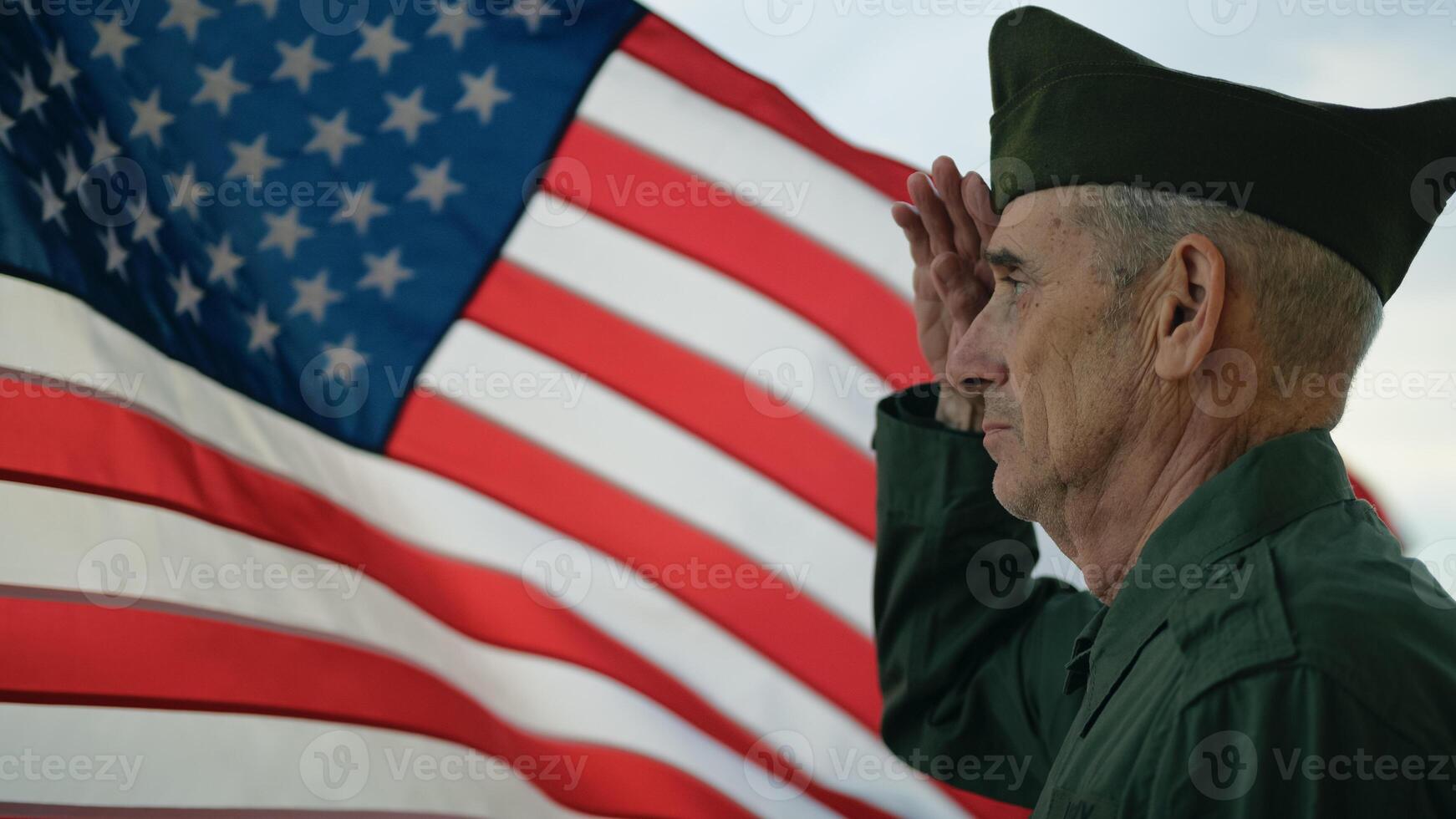 Veteran Stand Against The American Flag For Memorial Day photo