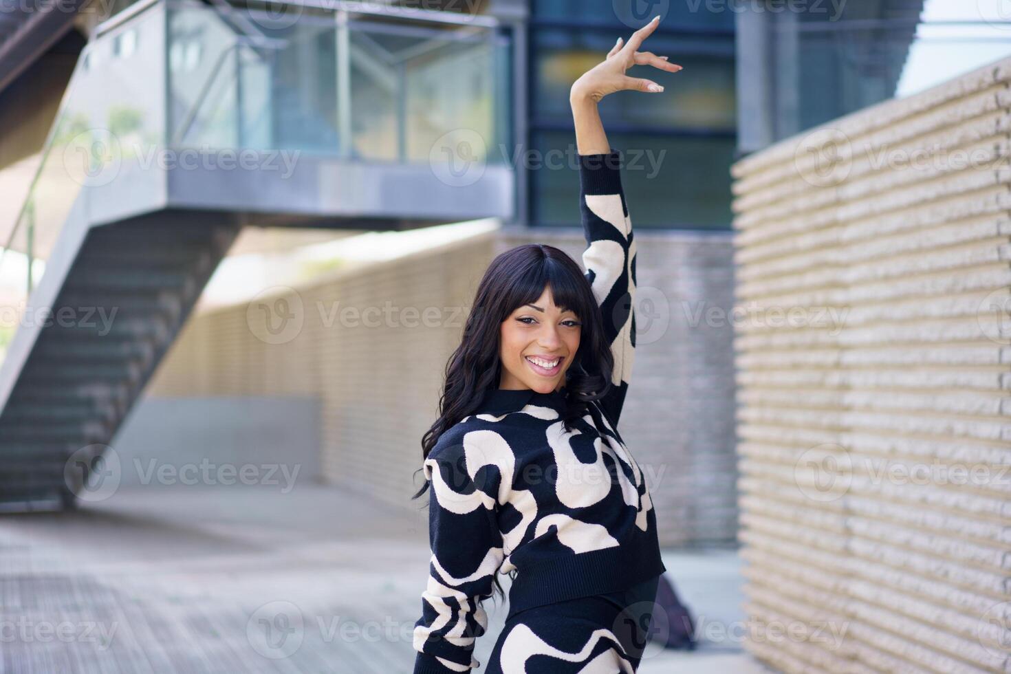 Beauty dancer posing outside an urban building photo