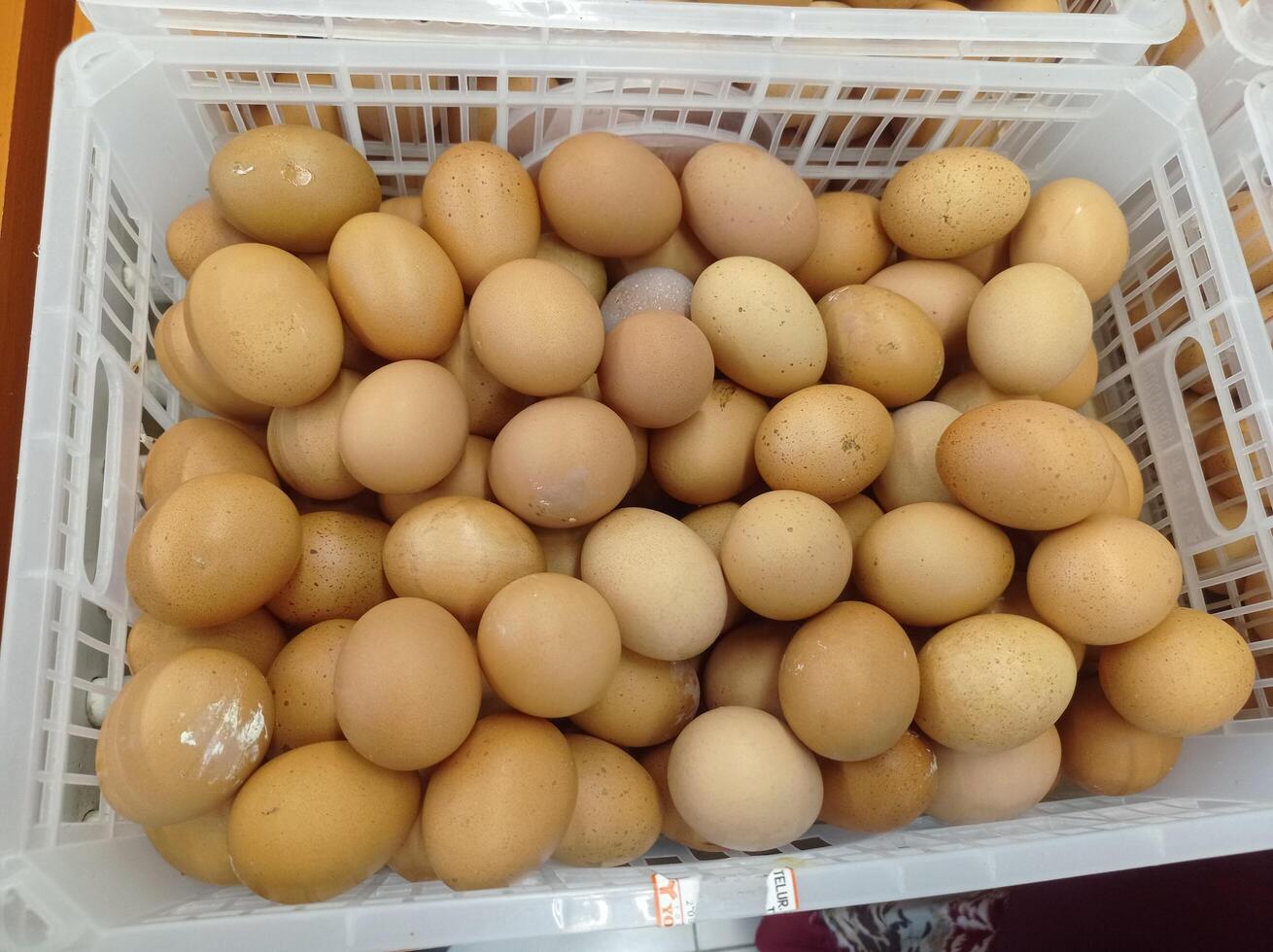 chicken eggs in a minimarket basket photo