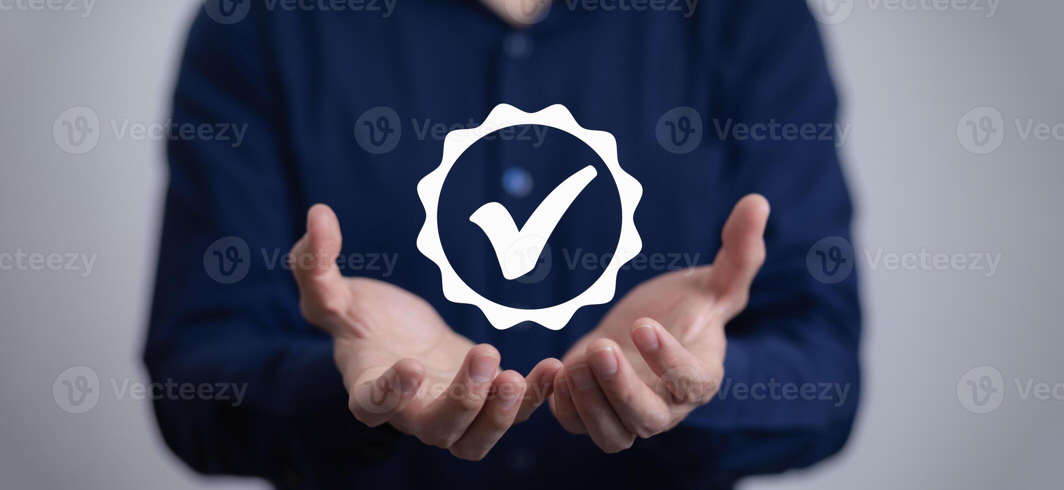 Quality assurance of business services, Businessman Hand shows the sign of the top service Quality assurance in Black background , Guarantee, Standards, ISO certification and standardization concept. photo