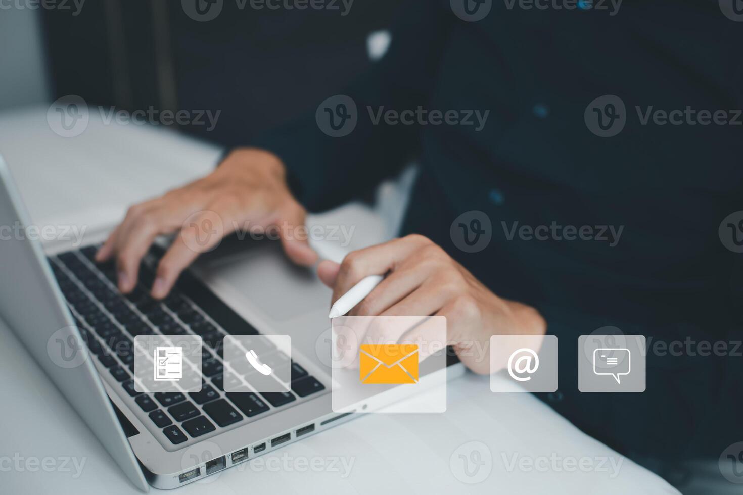 Communication and Contact us or Customer support hotline people connect. Hand using a laptop and touching on virtual screen contact icons, email and address, live chat with internet wifi. photo