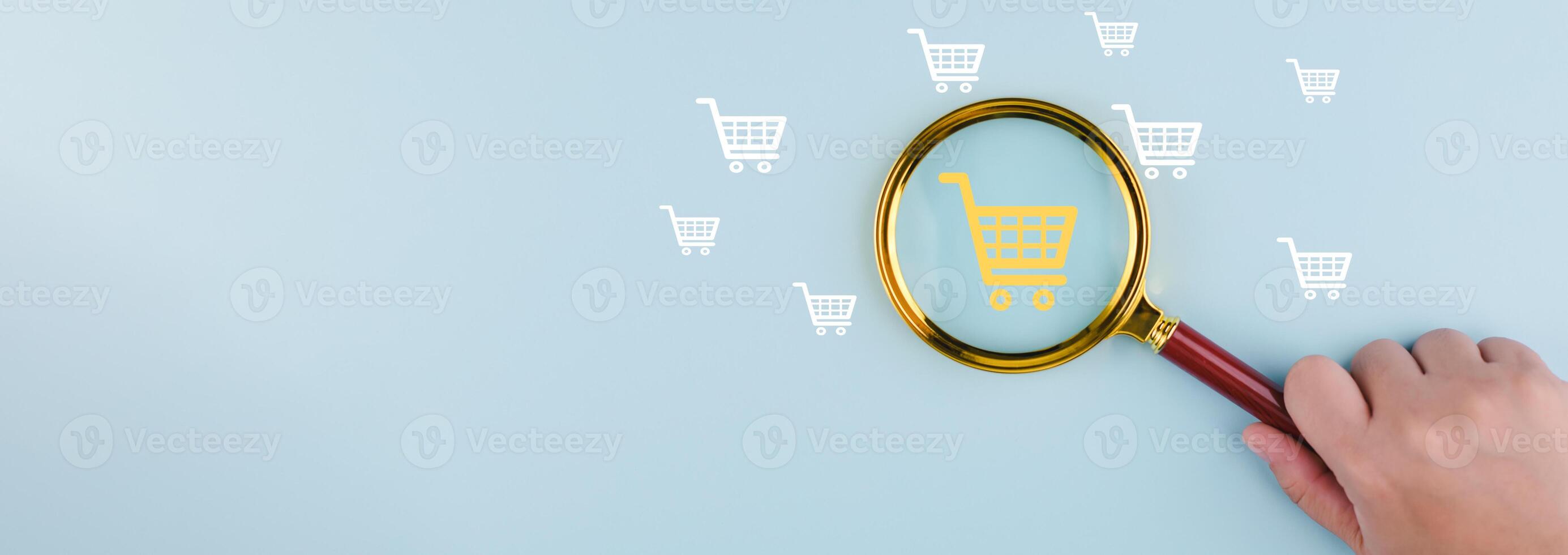 Magnifying glass focus with online shopping concept, marketplace website with virtual interface of online Shopping cart part of the network, Online shopping business with selecting shopping cart. photo